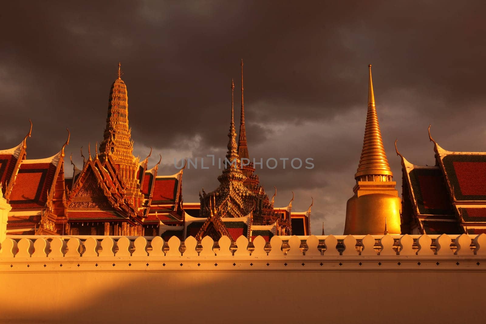 The temple gelaende in the evening atmosphere with Wat Phra Keo at the Royal Palace in the historical center of the capital Bangkok in Thailand.