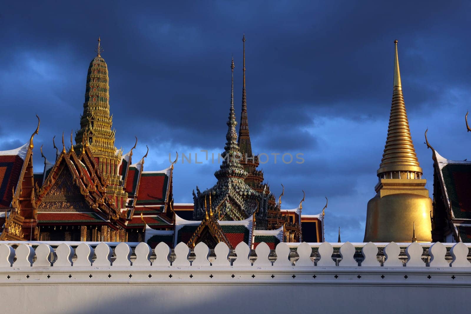 The temple gelaende in the evening atmosphere with Wat Phra Keo at the Royal Palace in the historical center of the capital Bangkok in Thailand.