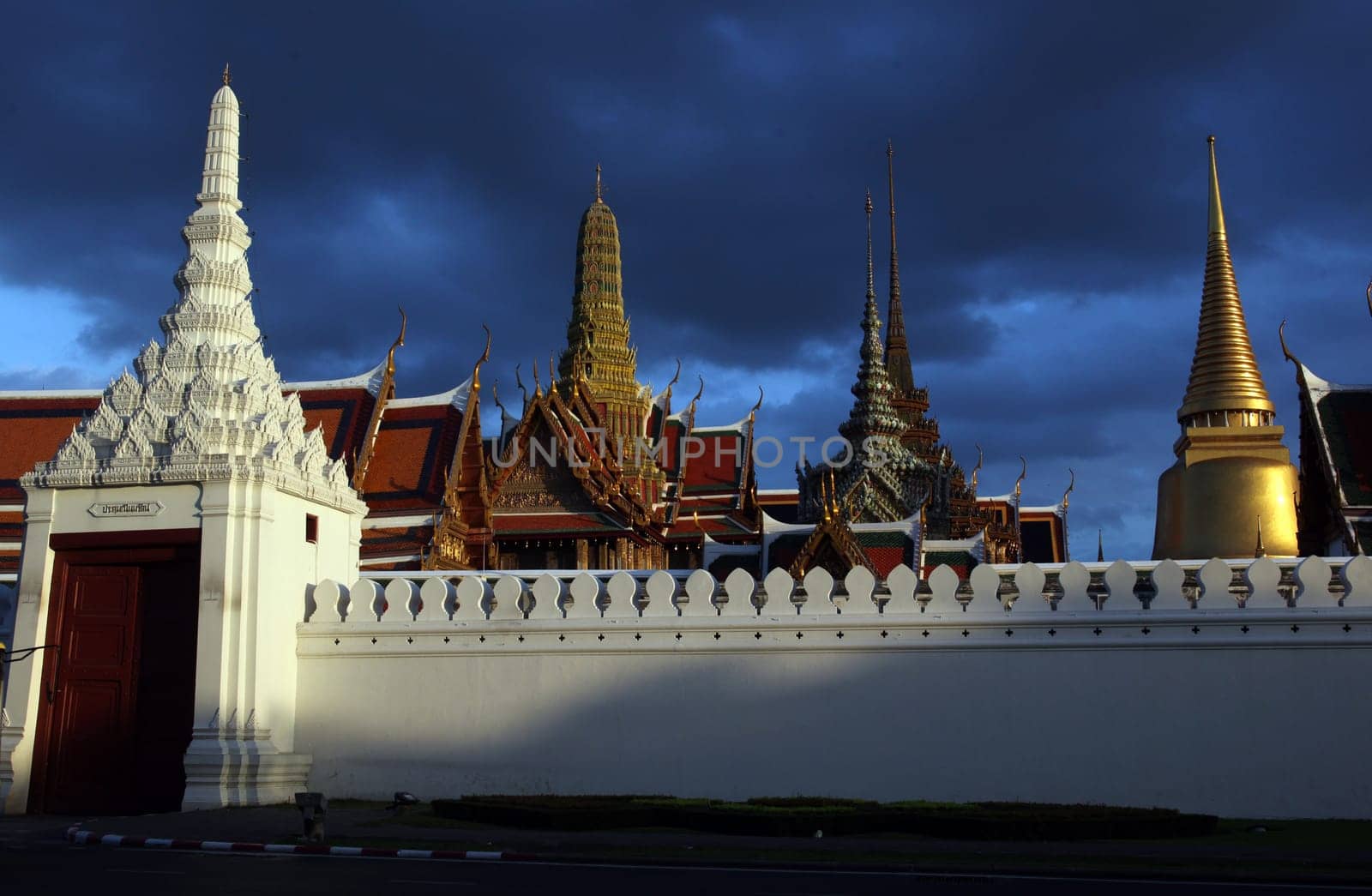 The temple gelaende in the evening atmosphere with Wat Phra Keo at the Royal Palace in the historical center of the capital Bangkok in Thailand.