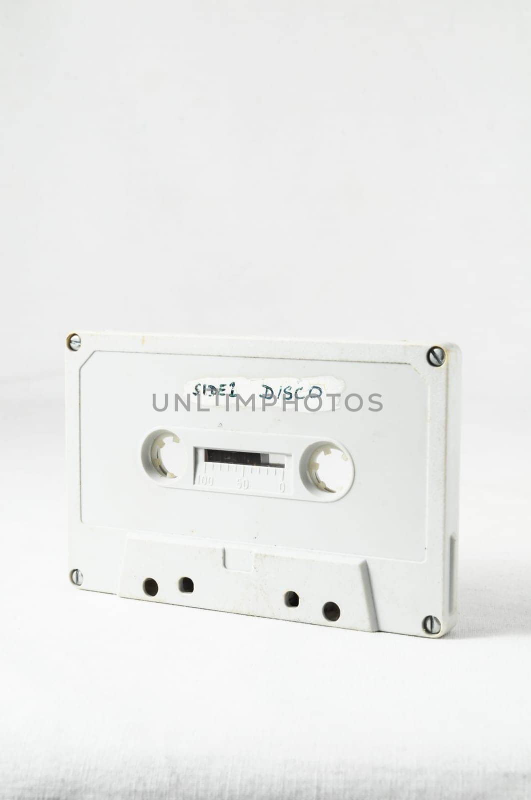 Ancient Vintage Used Musicassette over a White Background