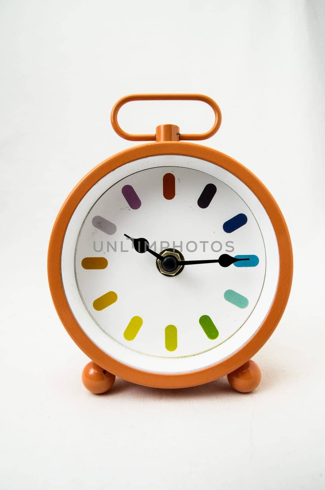 Orange Alarm Clock on a White Background