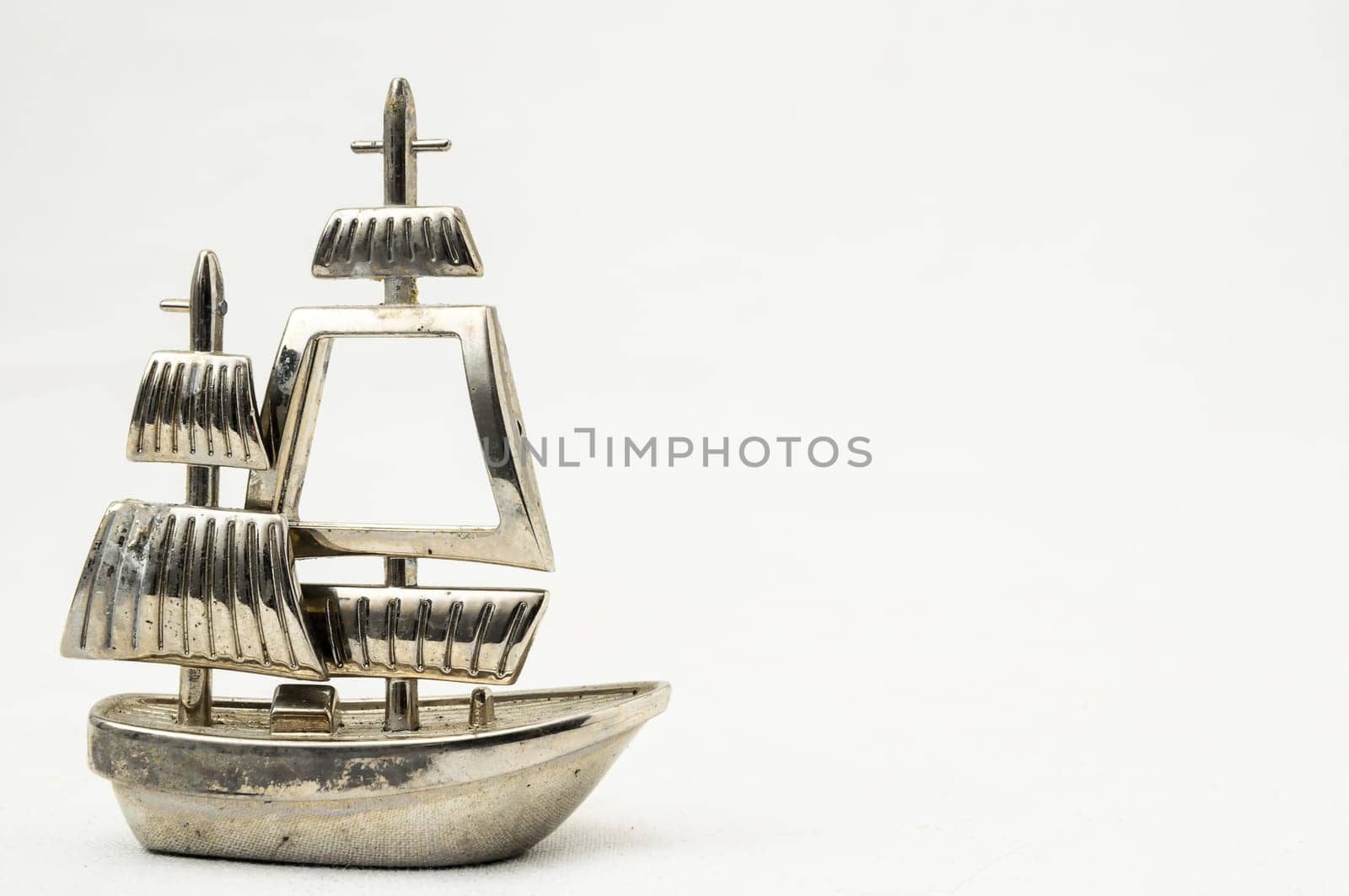 Metal Sailing Boat Figurine on a white background