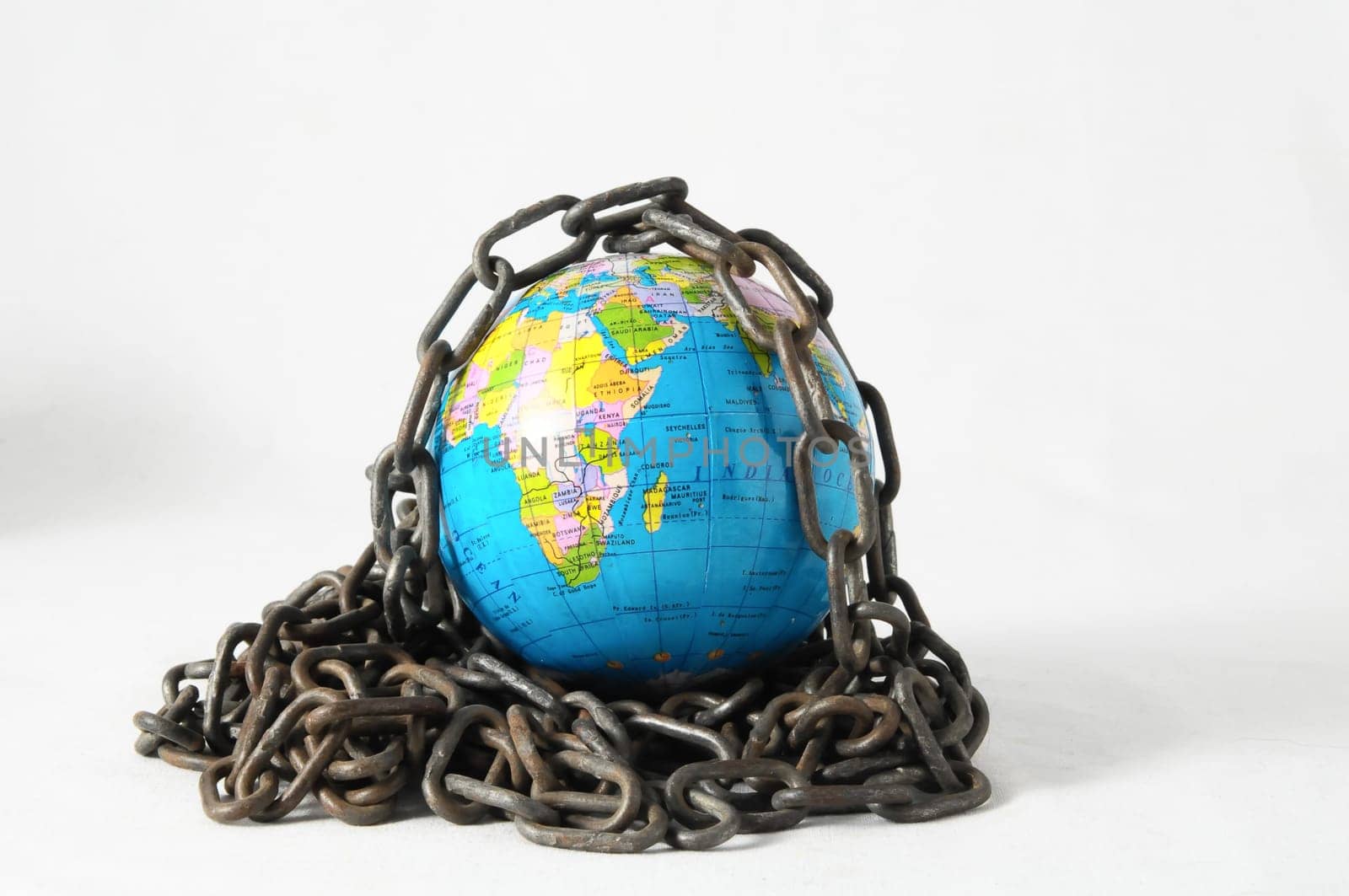 Earth globe close in chain and padlock