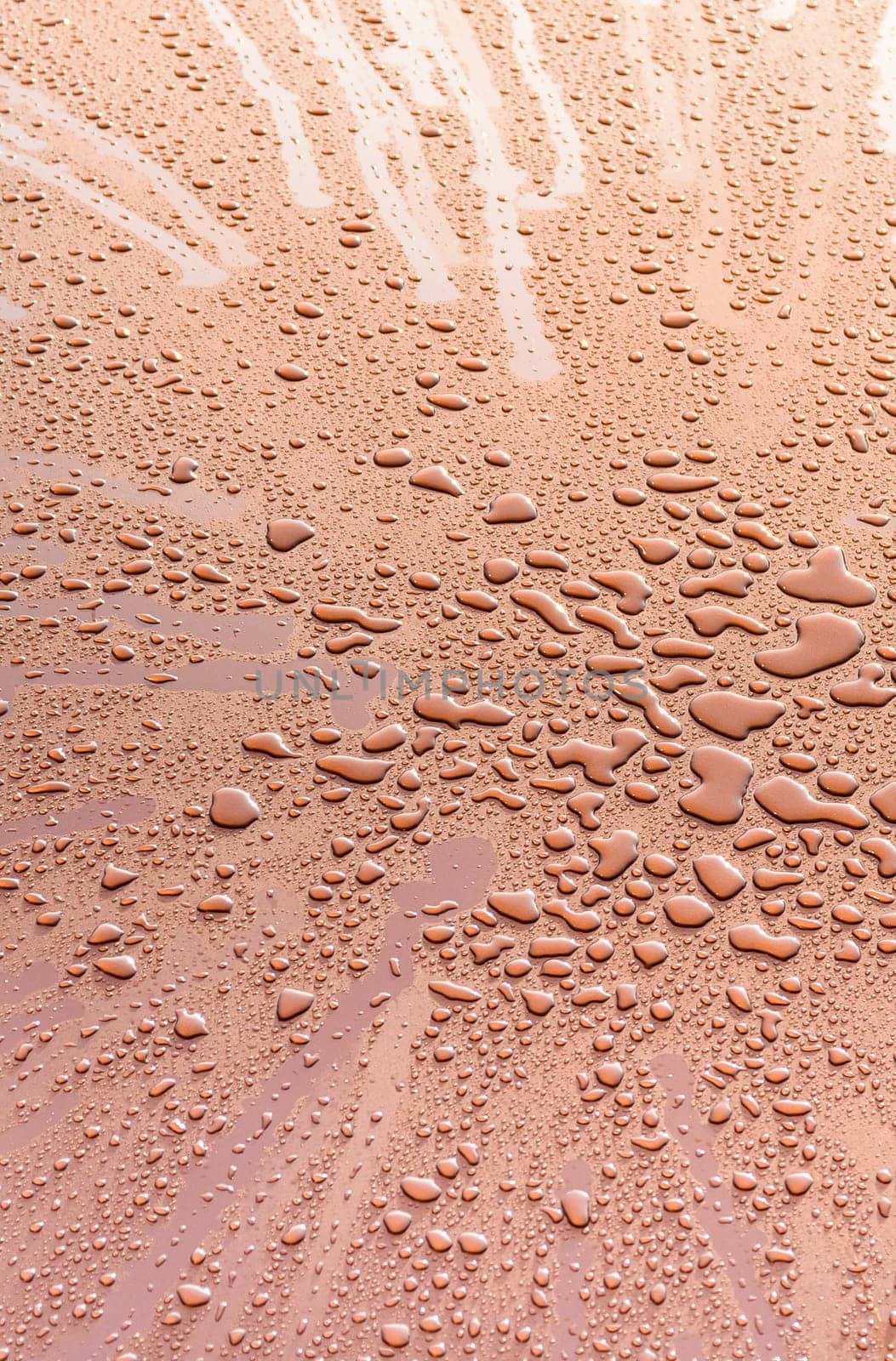 Visible cluster of big drops in gold metal sheet,abstract backgroud,texture.