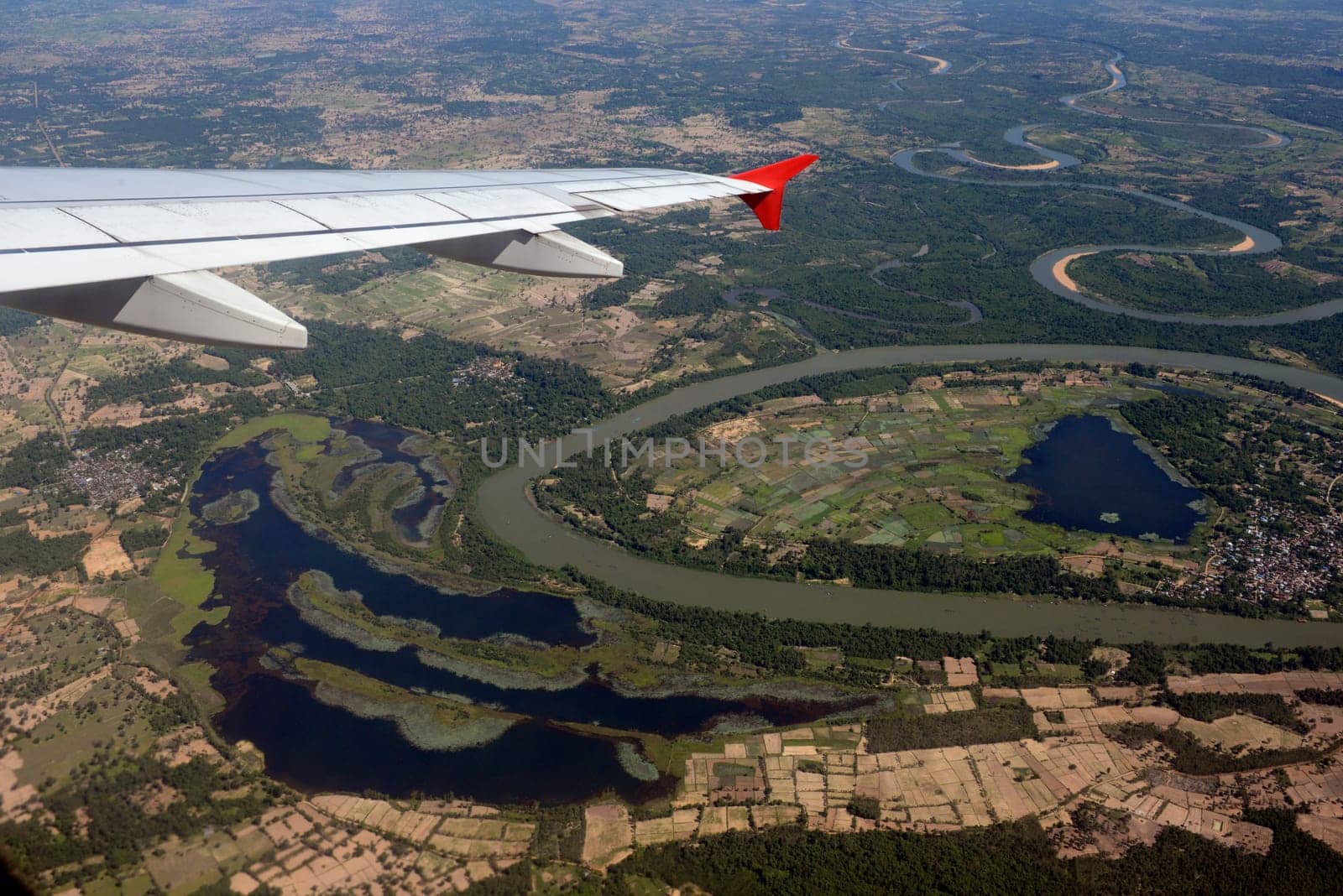 The landscape of an airplane over the surroundings of Ubon Ratchathani in the northeast of Thailand in South East Asia.