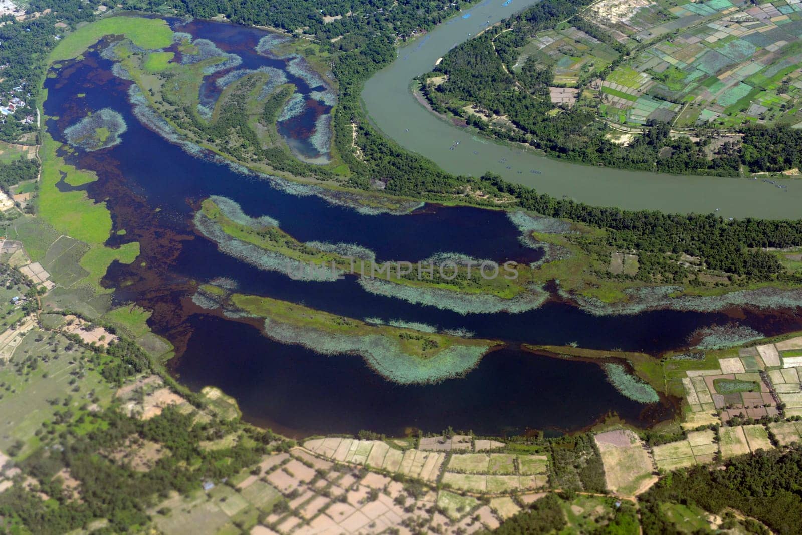 The landscape of an airplane over the surroundings of Ubon Ratchathani in the northeast of Thailand in South East Asia.