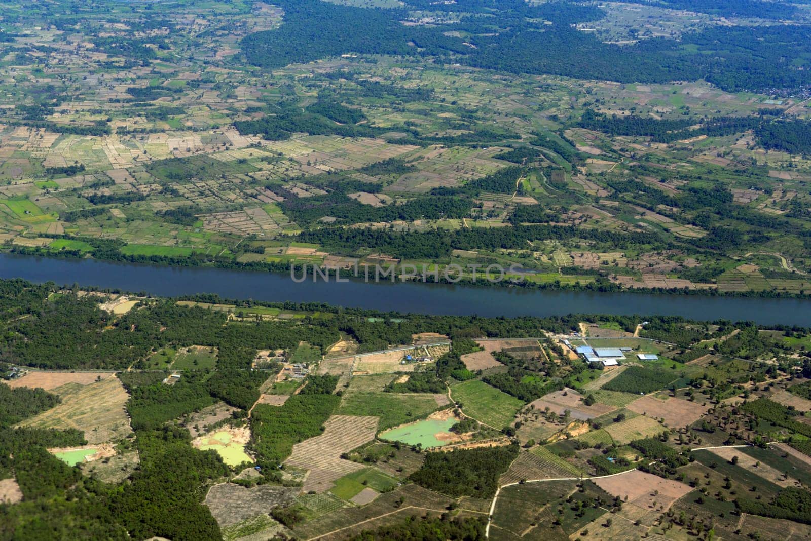 The landscape of an airplane over the surroundings of Ubon Ratchathani in the northeast of Thailand in South East Asia.