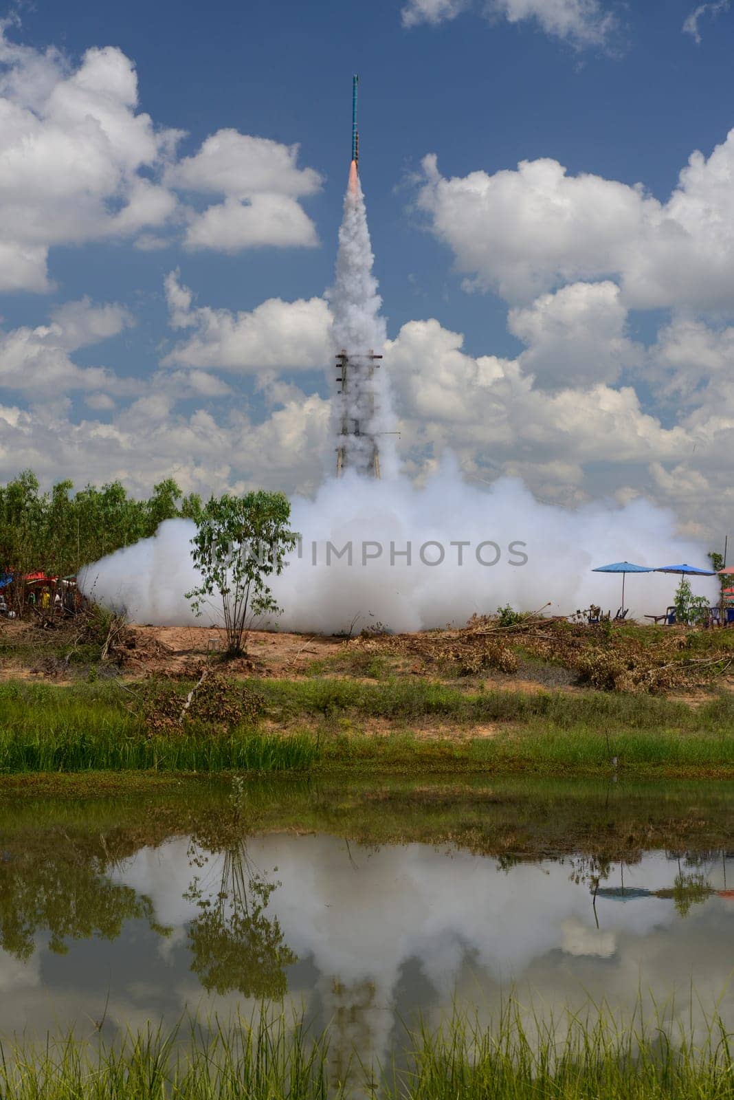 A racket starts at the traditional rocket festival or Bun Bang Fai or Rocket Festival in Ban Si Than in Amnat Charoen province northwest of Ubon Ratchathani in northeastern Thailand in South East Asia.