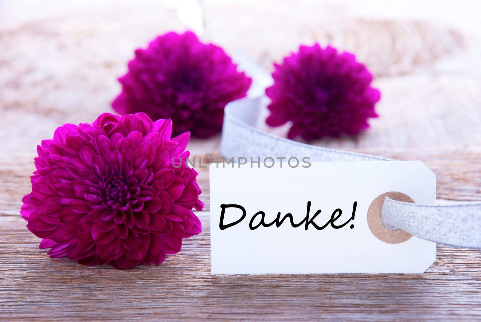 Label with the german word Danke which means Thanks and Purple Flowers
