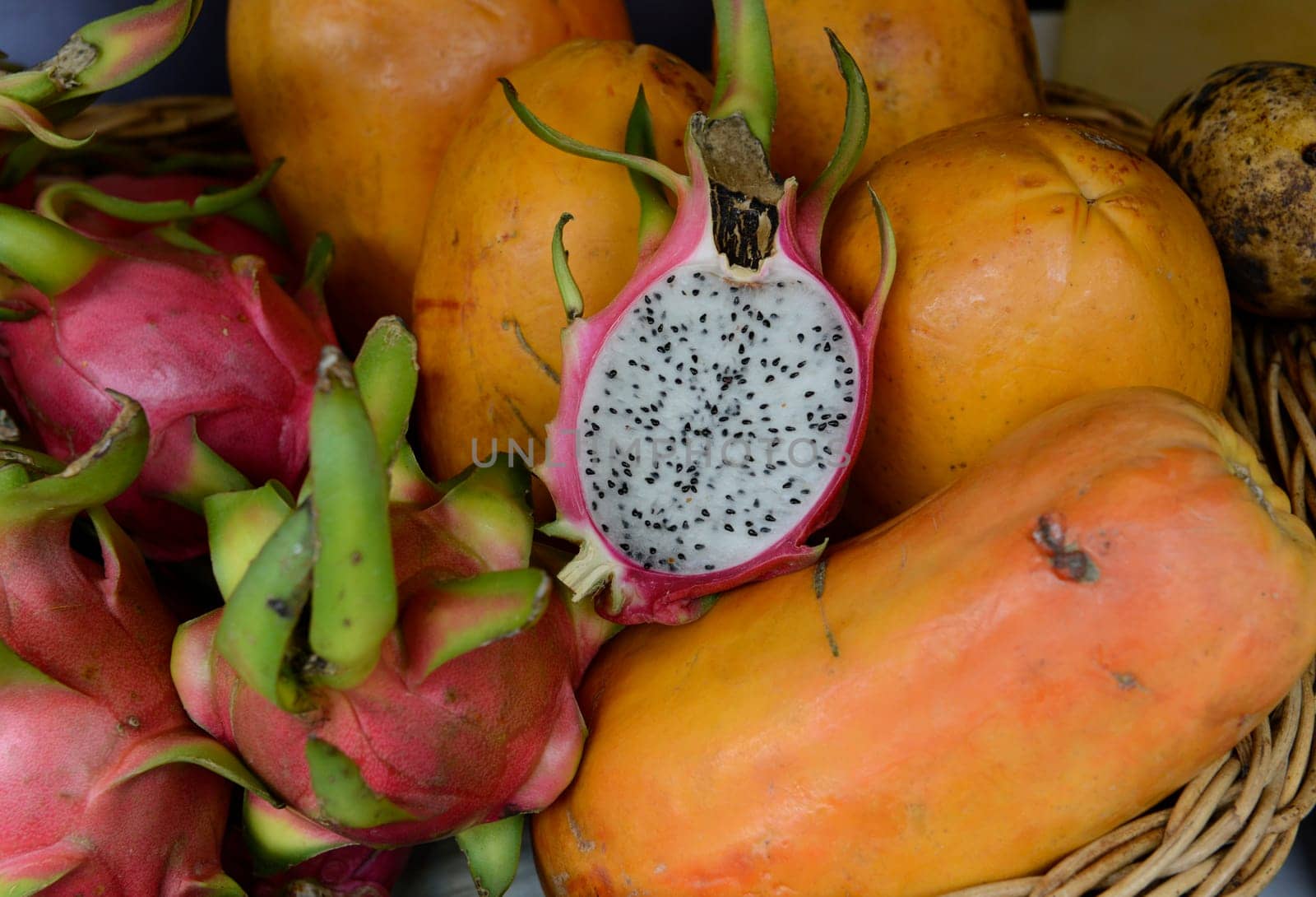 Breakfast with a dragon fruit at a market in Chiang Mai in northern Thailand in South East Asia.