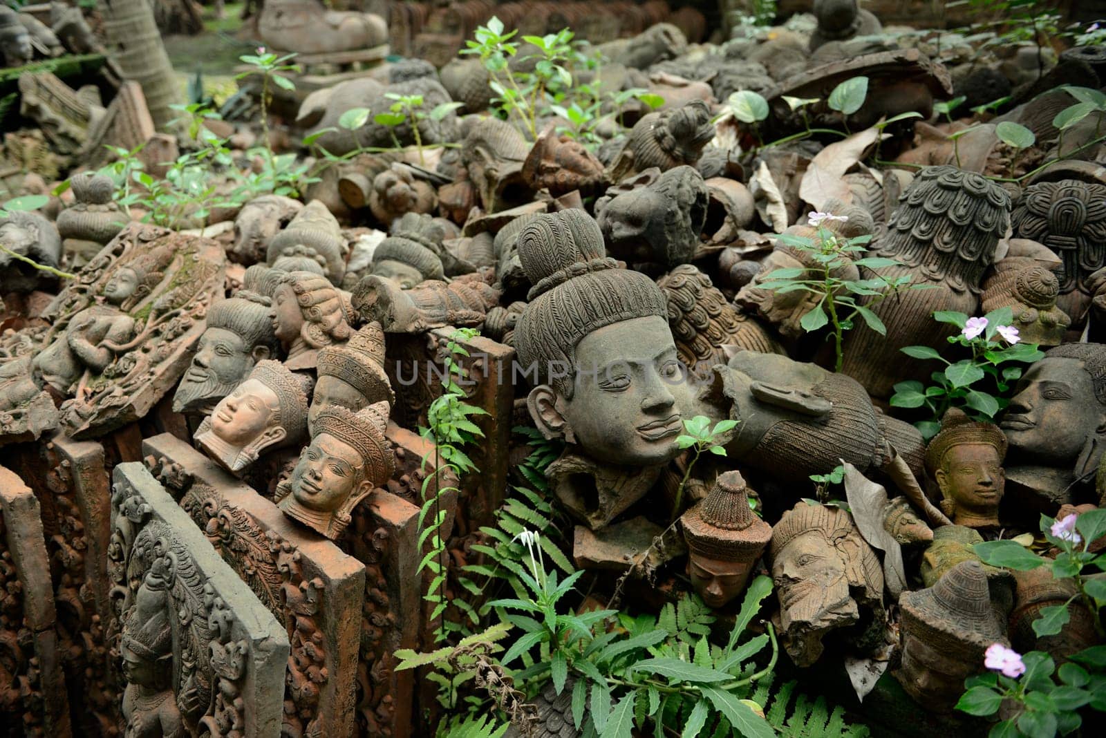 Traditional figures are available for sale in the garden of Ban Phor Linag Meun's Terracota Art at Terracota Garden in Chiang Mai in northern Thailand in South East Asia.