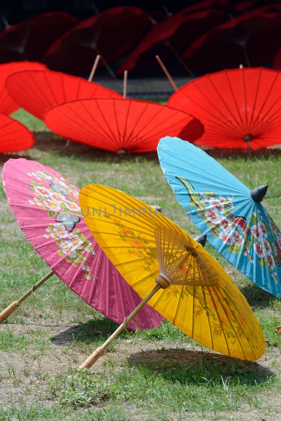 Traditionall umbrellas and faechers from Paier are produced in a paper screen factory in Chiang Mai in the north of Thailand in South East Asia.