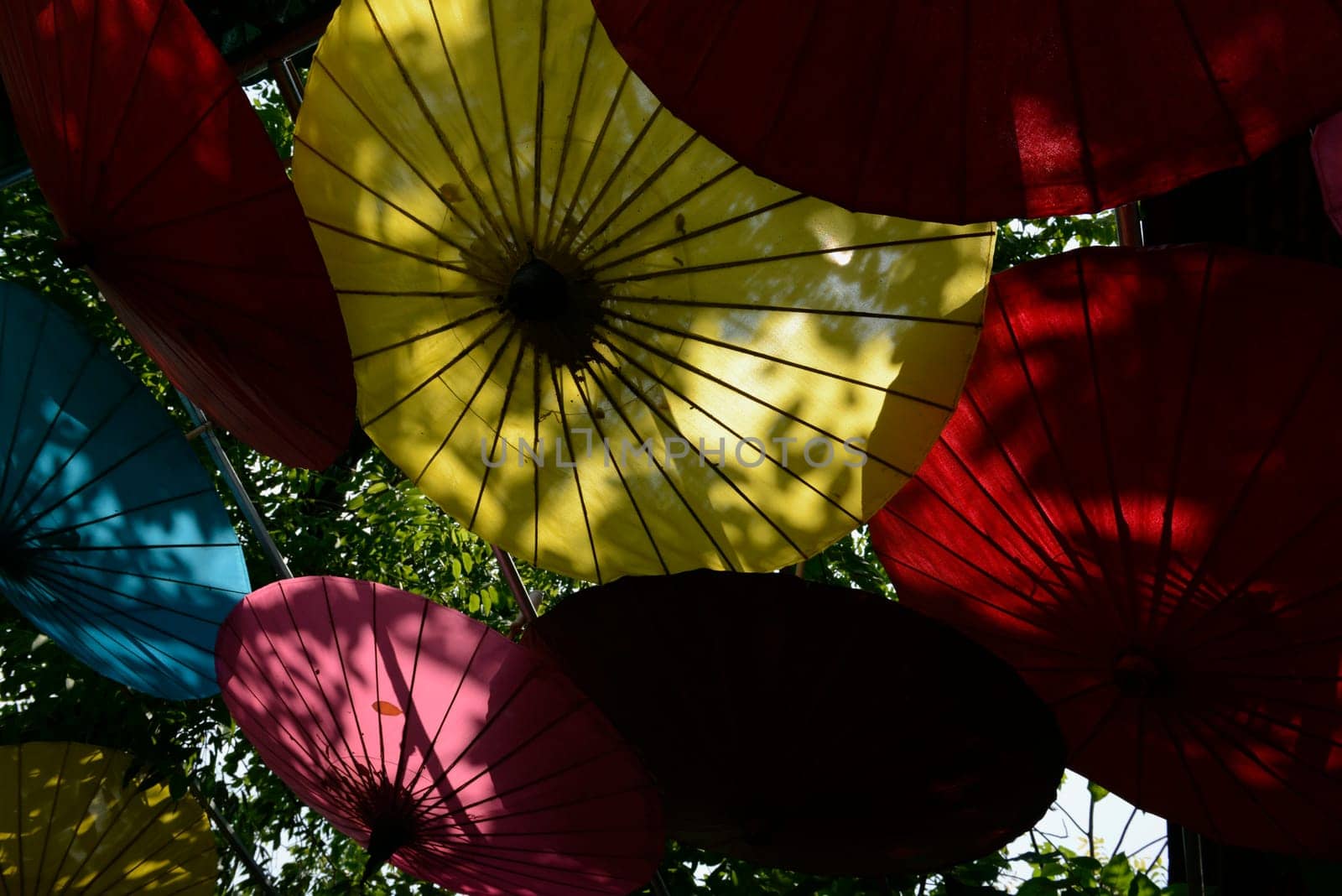 Traditionall umbrellas and faechers from Paier are produced in a paper screen factory in Chiang Mai in the north of Thailand in South East Asia.
