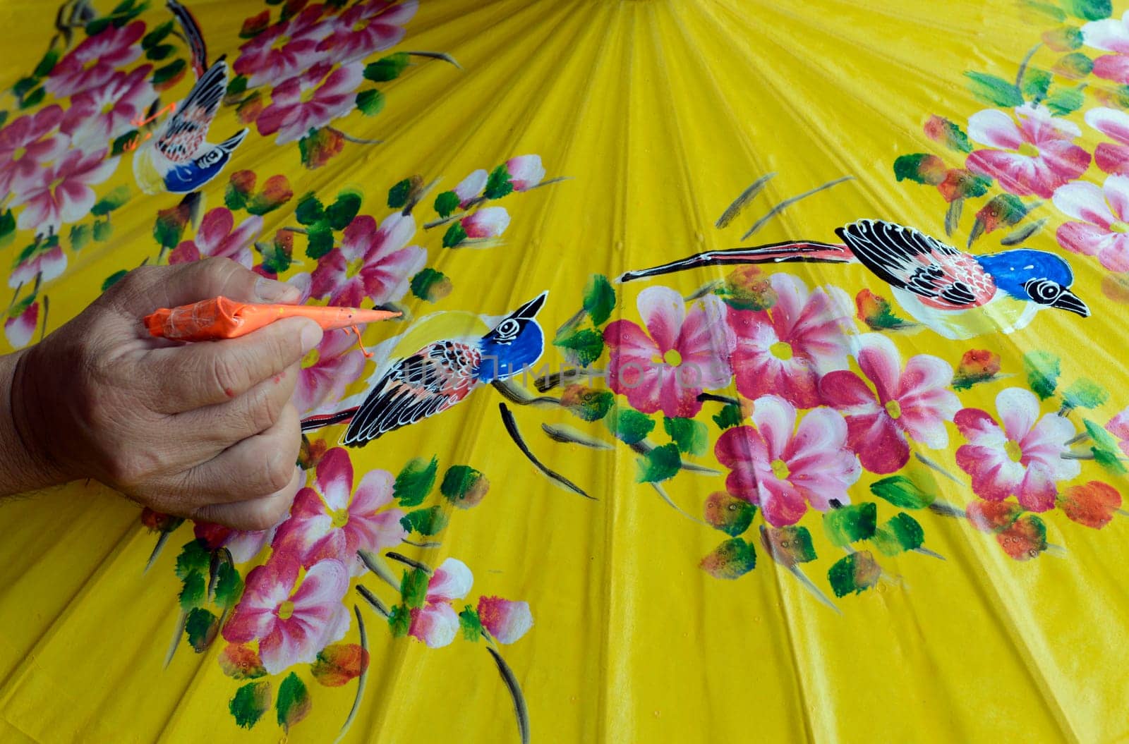 Traditionall umbrellas and faechers from Paier are produced in a paper screen factory in Chiang Mai in the north of Thailand in South East Asia.