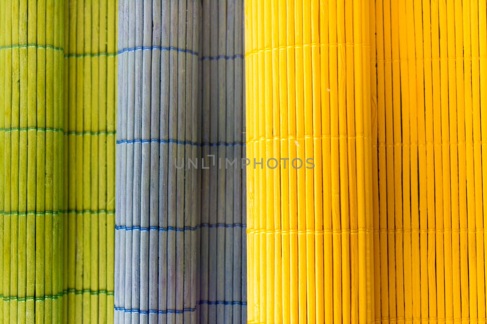 Tablecloths folders three different colors with a textured wooden branches