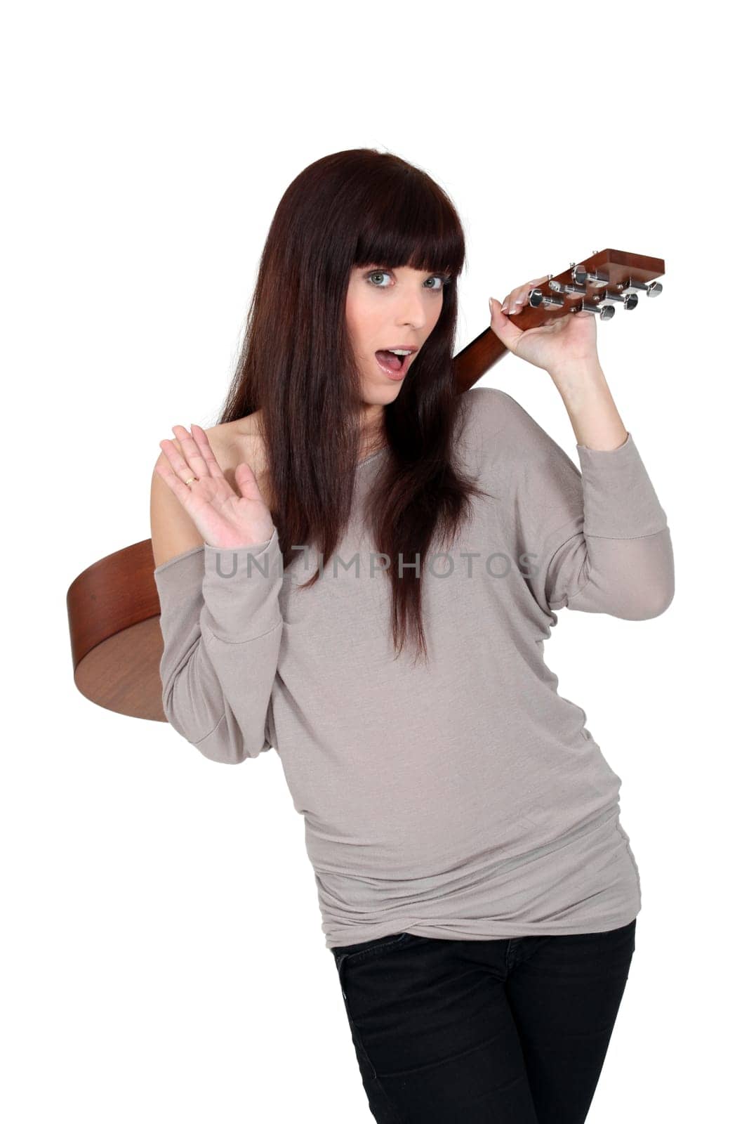 woman holding a guitar