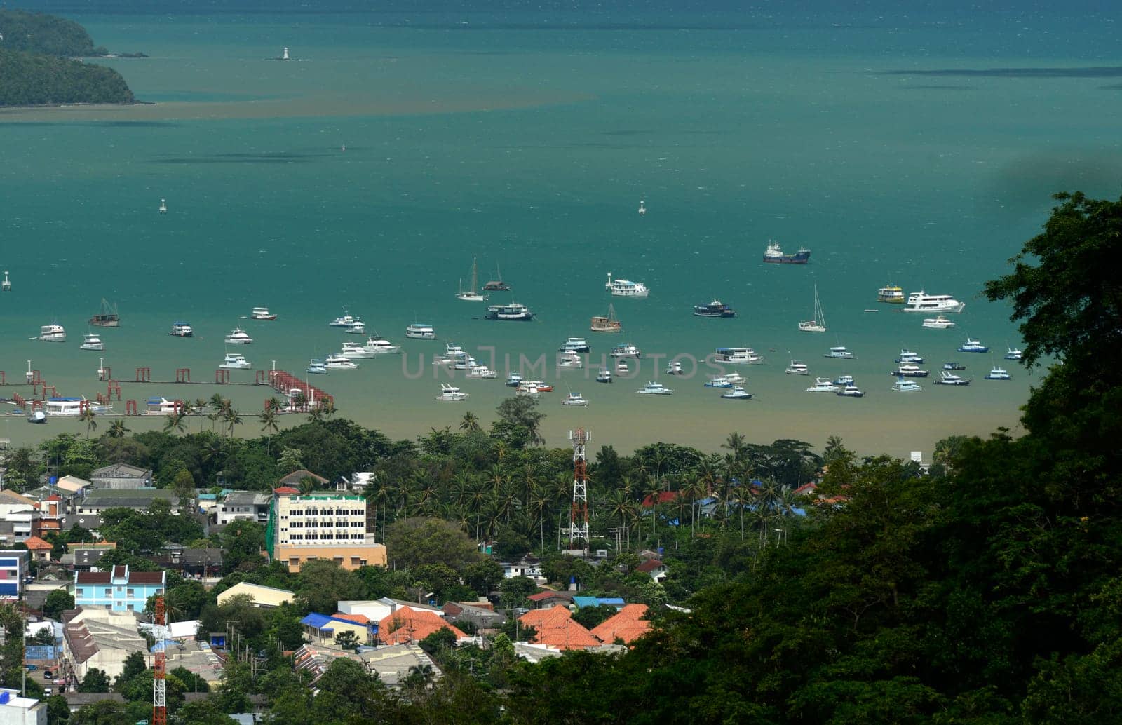 The view from the mountains to Chalong in the south of the island of Phuket in the south of Thailand in South East Asia.