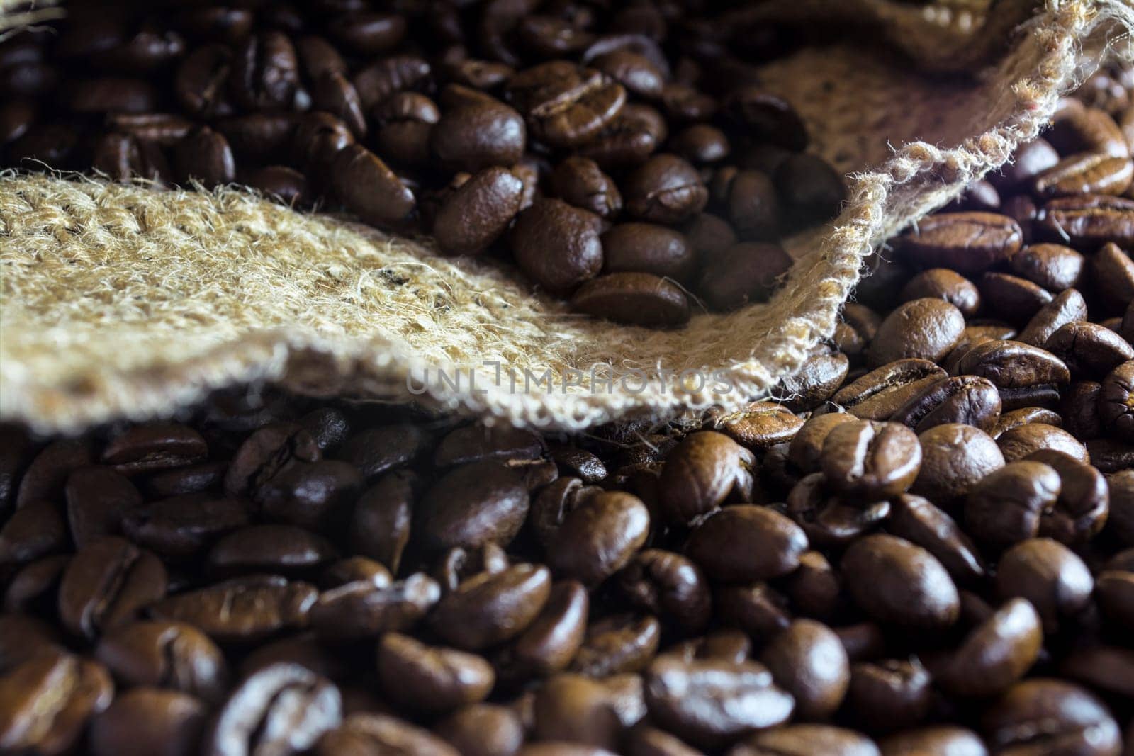 Coffee beans inside his jute bag with side lighting