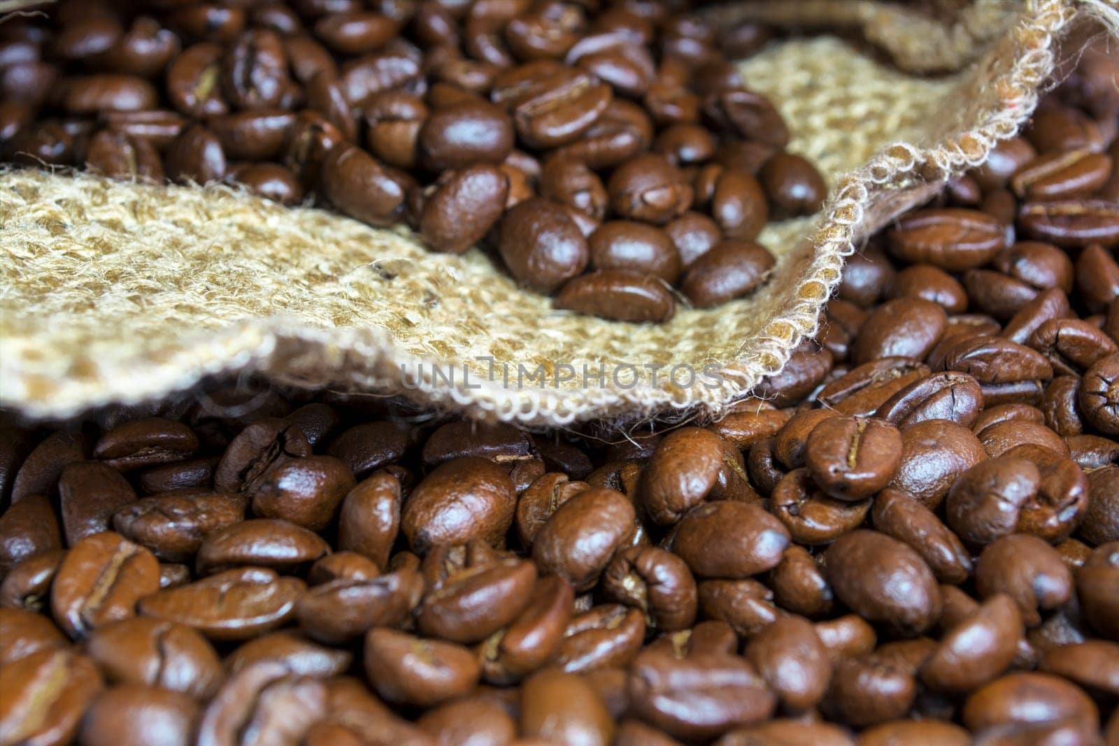 Coffee beans inside his jute bag with side lighting
