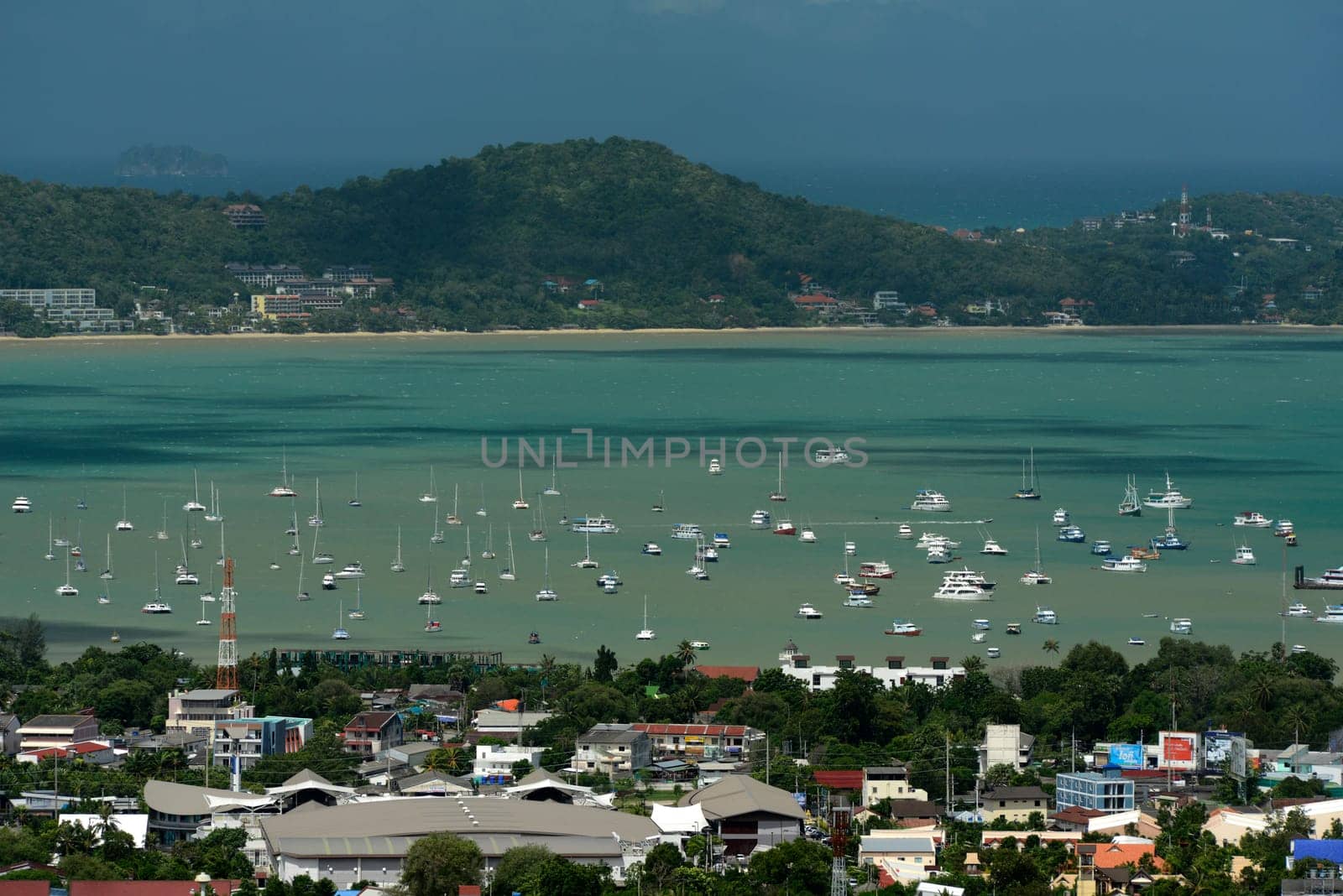 The view from the mountains to Chalong in the south of the island of Phuket in the south of Thailand in South East Asia.