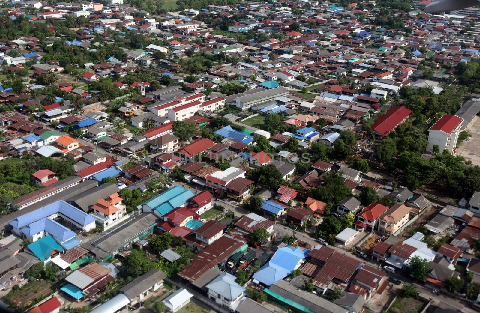 The view of the city of Ubon Rachathani in the Isan on the approach from Chiang mai to Ubon in northeastern Thailand.