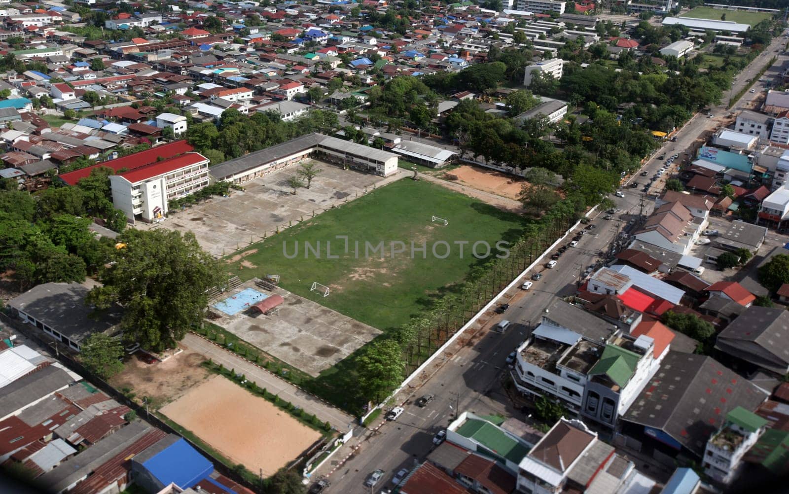 The view of the city of Ubon Rachathani in the Isan on the approach from Chiang mai to Ubon in northeastern Thailand.