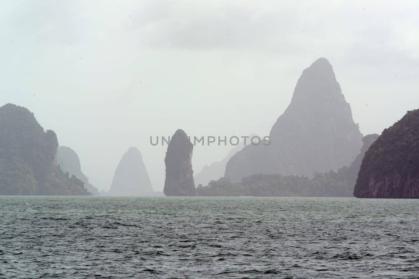 Limestone rocks and hollows in the Ao Phang Nga National Park a few minutes by boat from the main island of Puket on the island of Phuket in the south of Thailand in South East Asia.