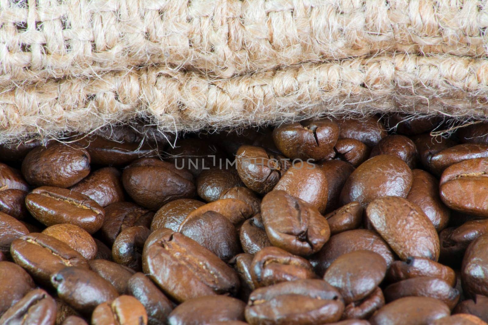 Details of coffee beans and jute bag texture