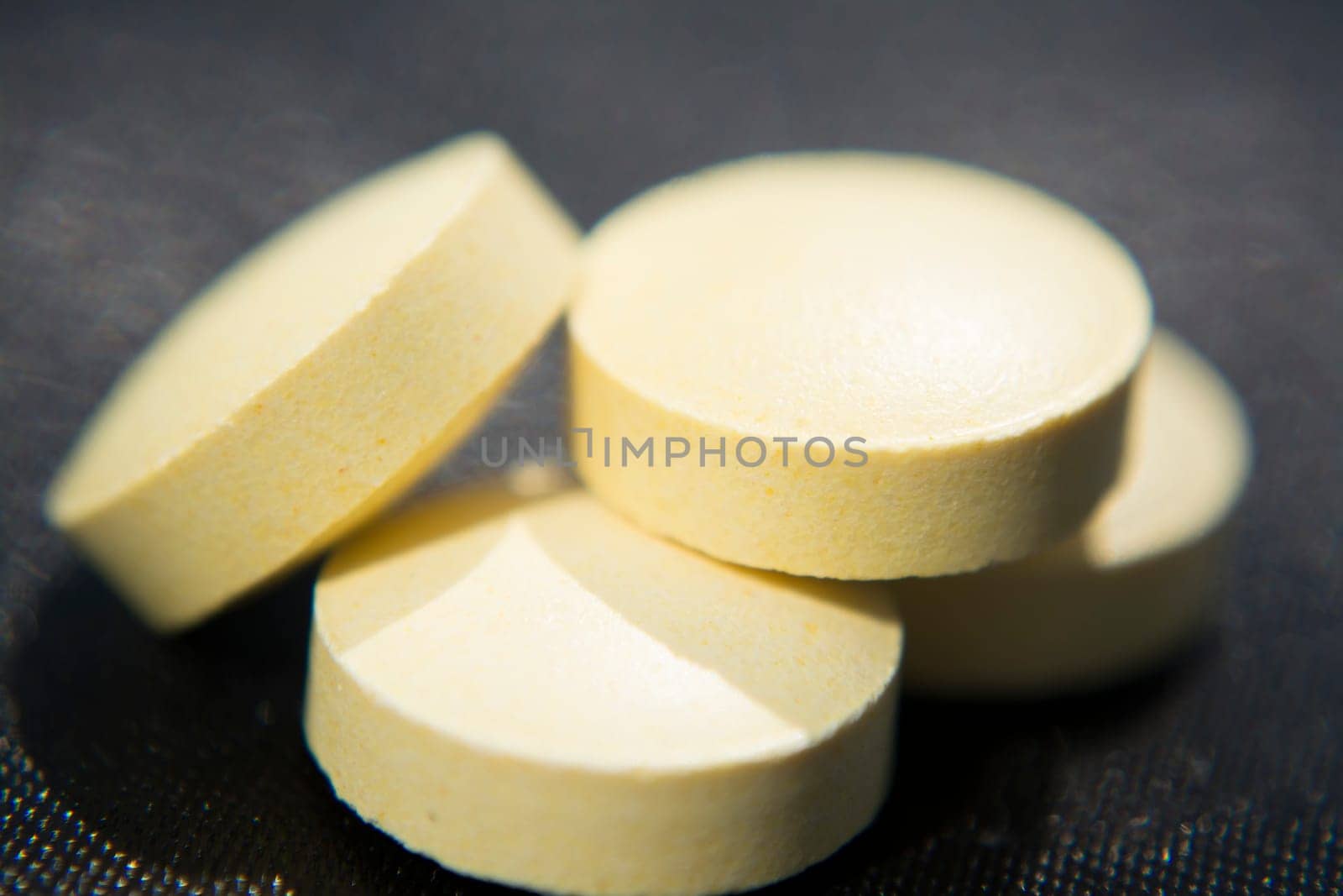 Macro to a round yellow pills