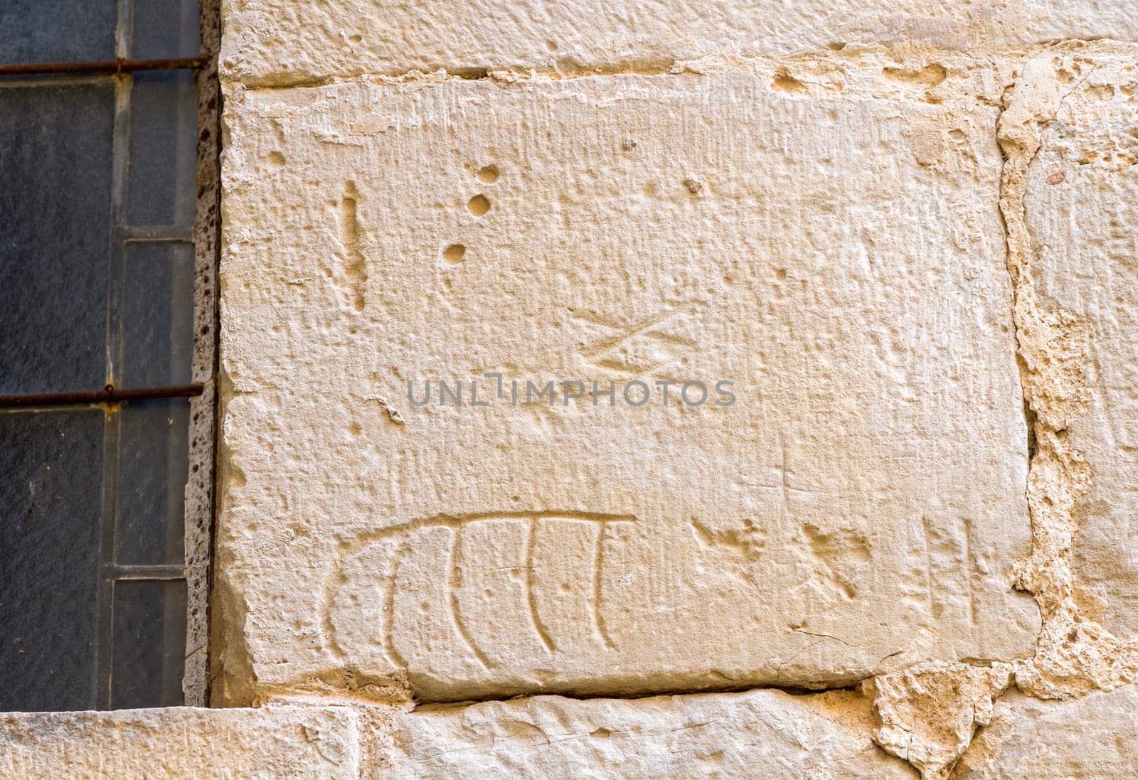 stonemason marks etched in stone. Santa Maria de Poblet, Catañuña, Spain