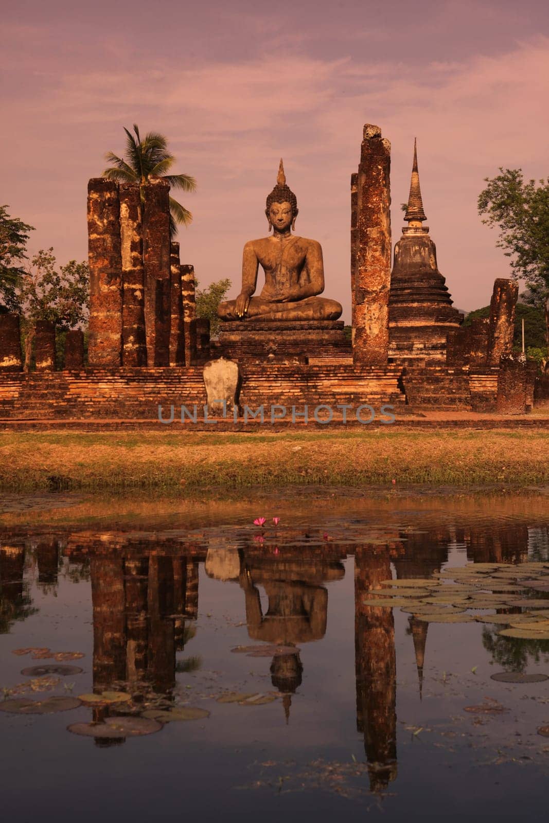 The Wat Mahathat Temple in the temple complex of Alt-Sukhothai in the province of Sukhothai in the north of Thailand in South East Asia.