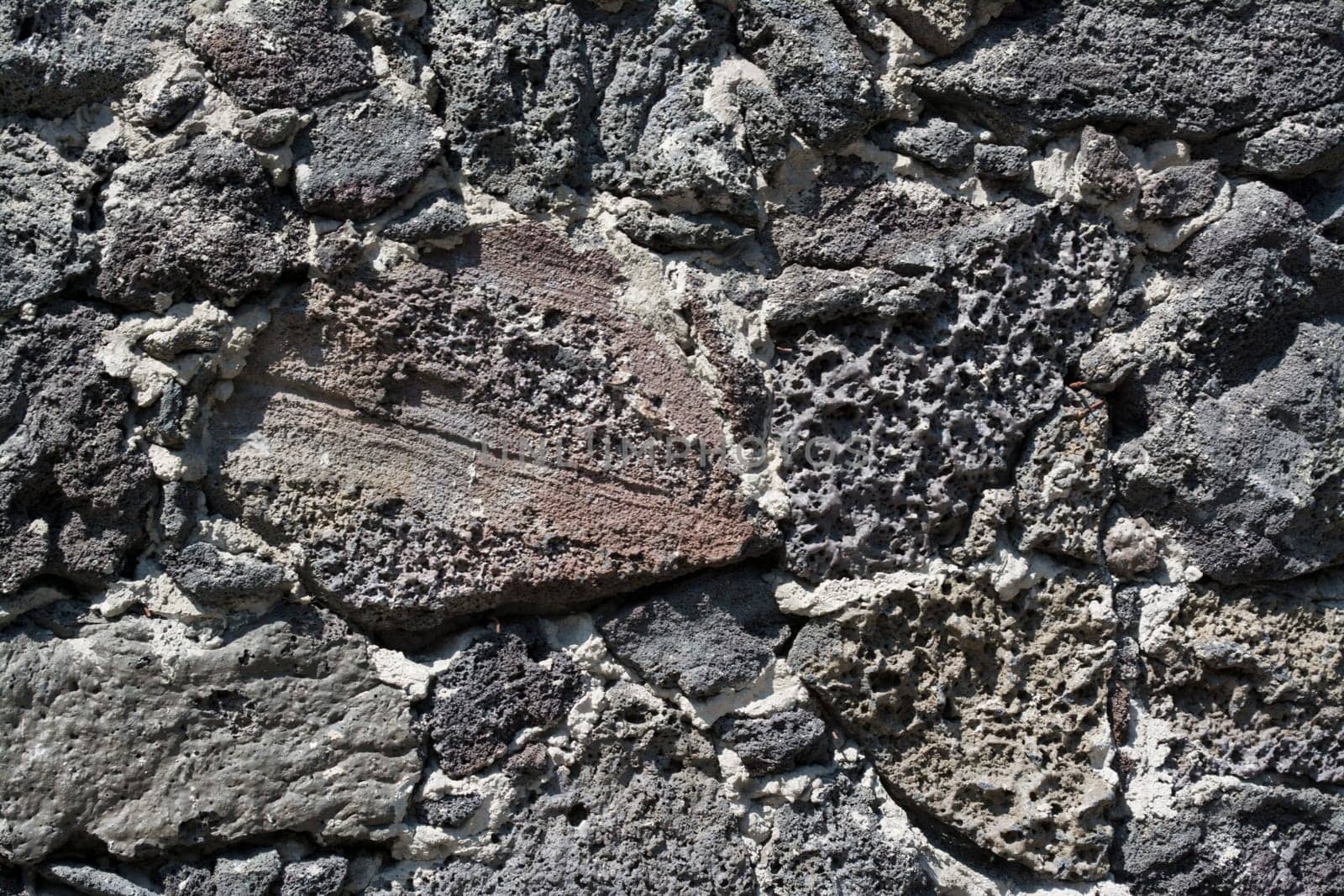 Wall of volcanic rock and cement to detail
