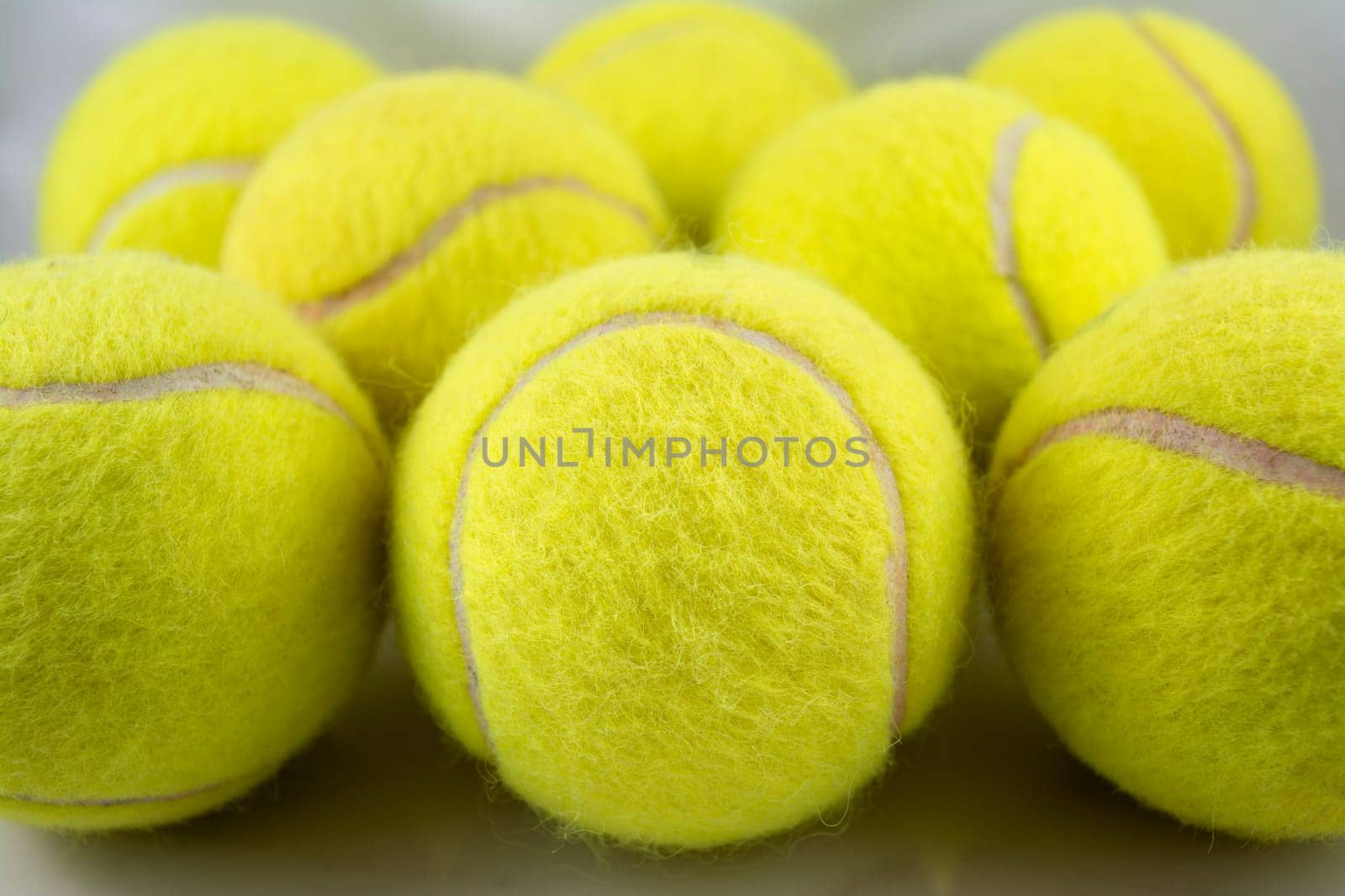 Approaching tennis balls set. You can see the texture of the fibers and fluoresce