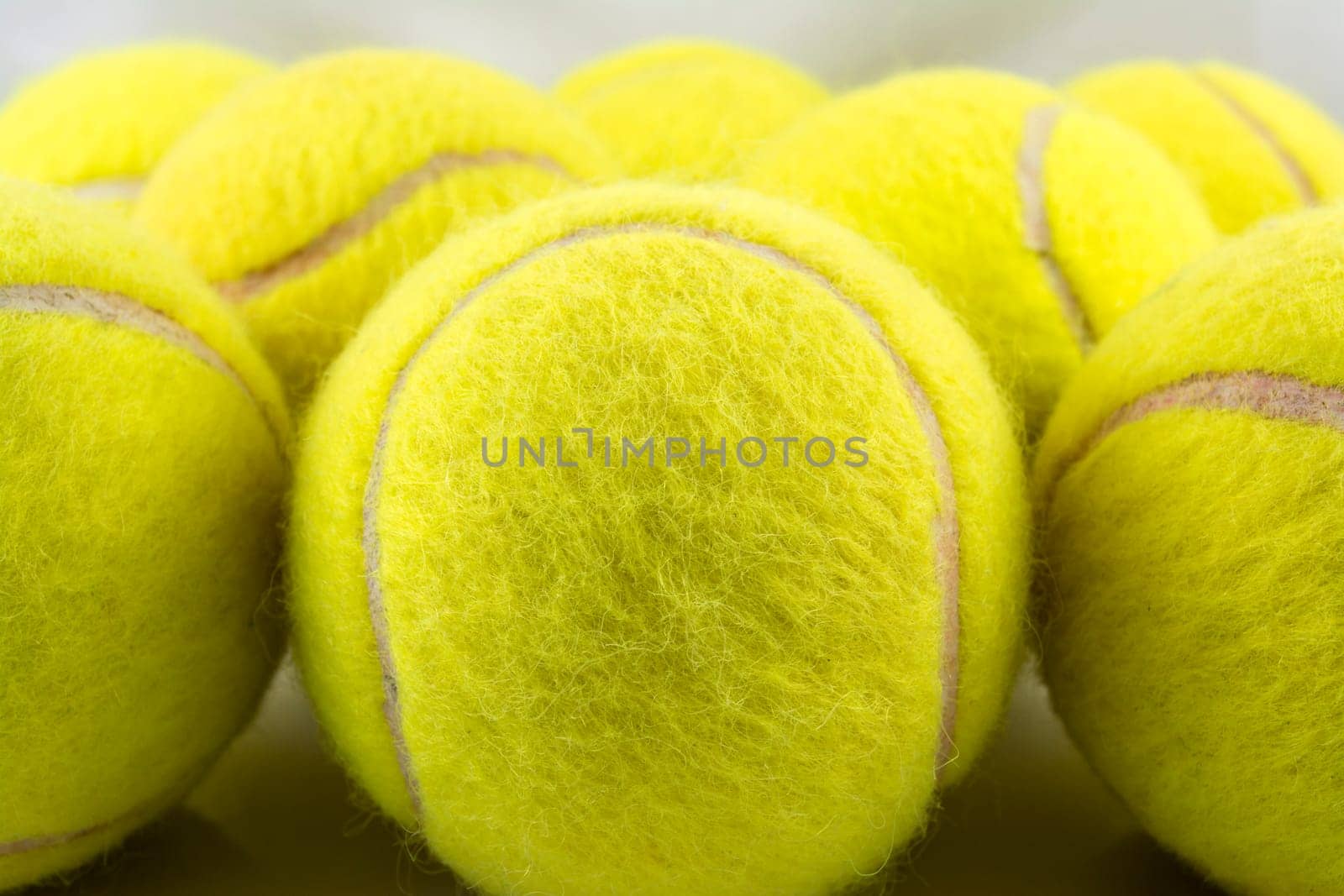 Approaching tennis balls set. You can see the texture of the fibers and fluoresce