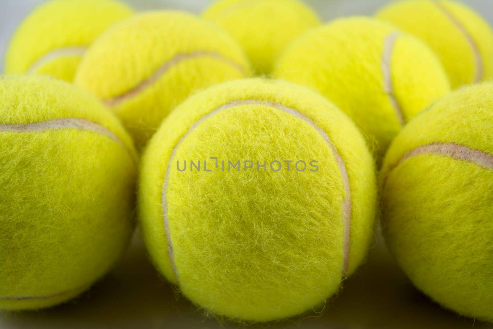 Approaching tennis balls set. You can see the texture of the fibers and fluoresce
