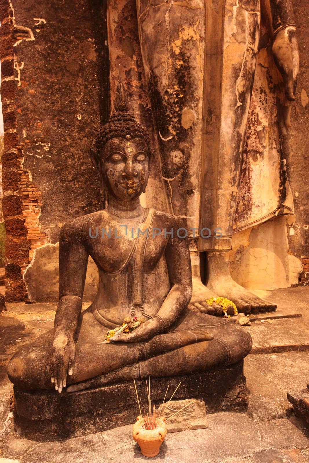A Buddha figure at Wat Saphan Hin Temple in the temple complex of Alt-Sukhothai in Sukhothai Province in northern Thailand in South East Asia.