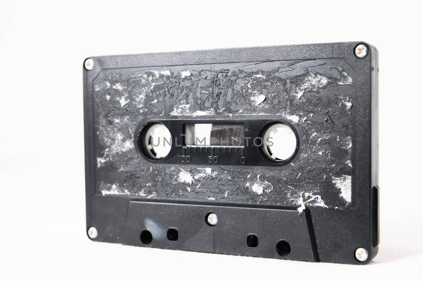 Ancient Vintage Used Musicassette over a White Background