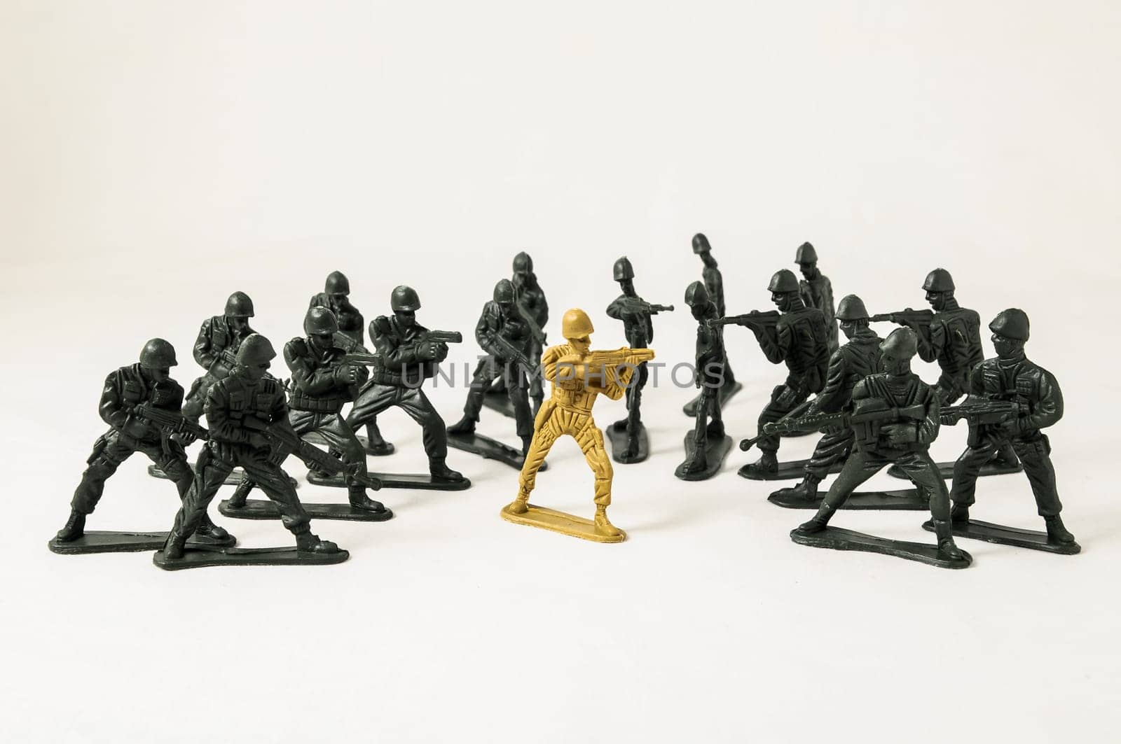 Plastic Lead Soldiers Representing War on a White Background