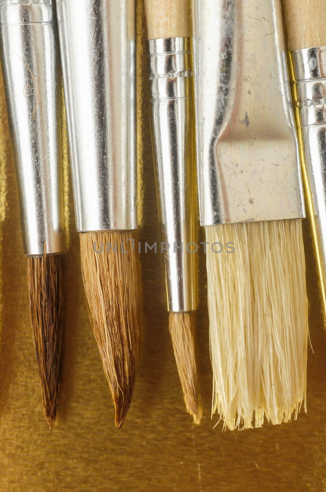 New Wooden Different Paintbrush Set Texture over a Colored Background