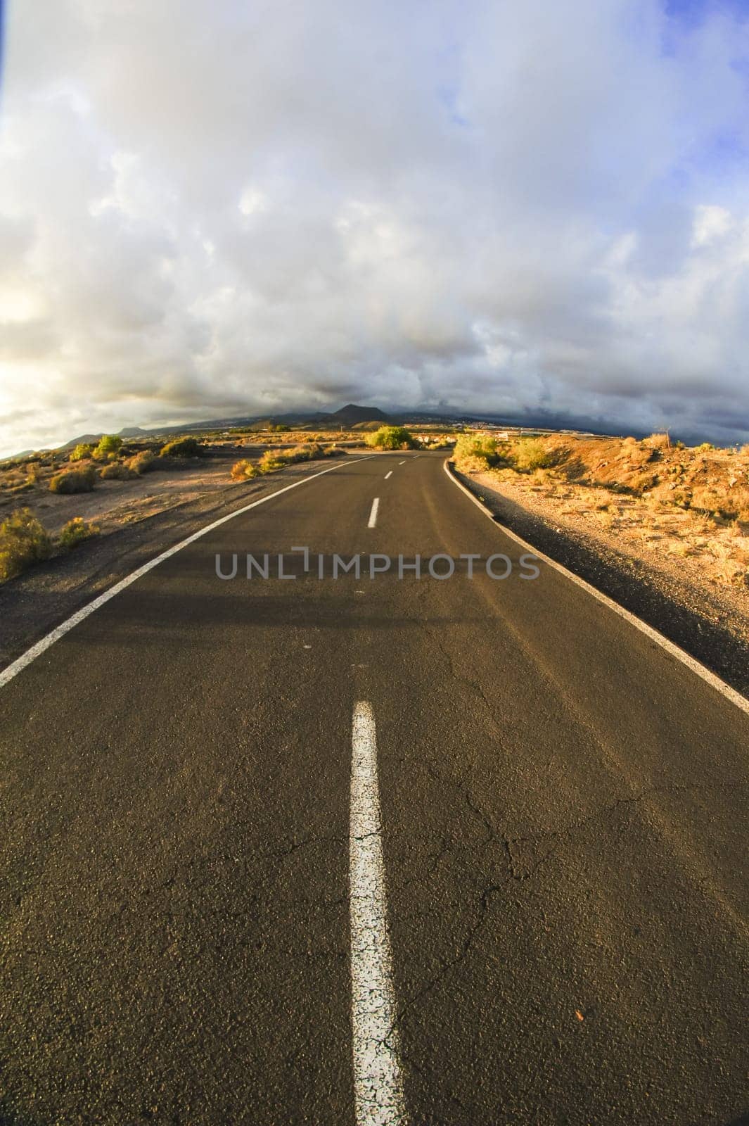 Long Empty Desert Road on a Cludy Day