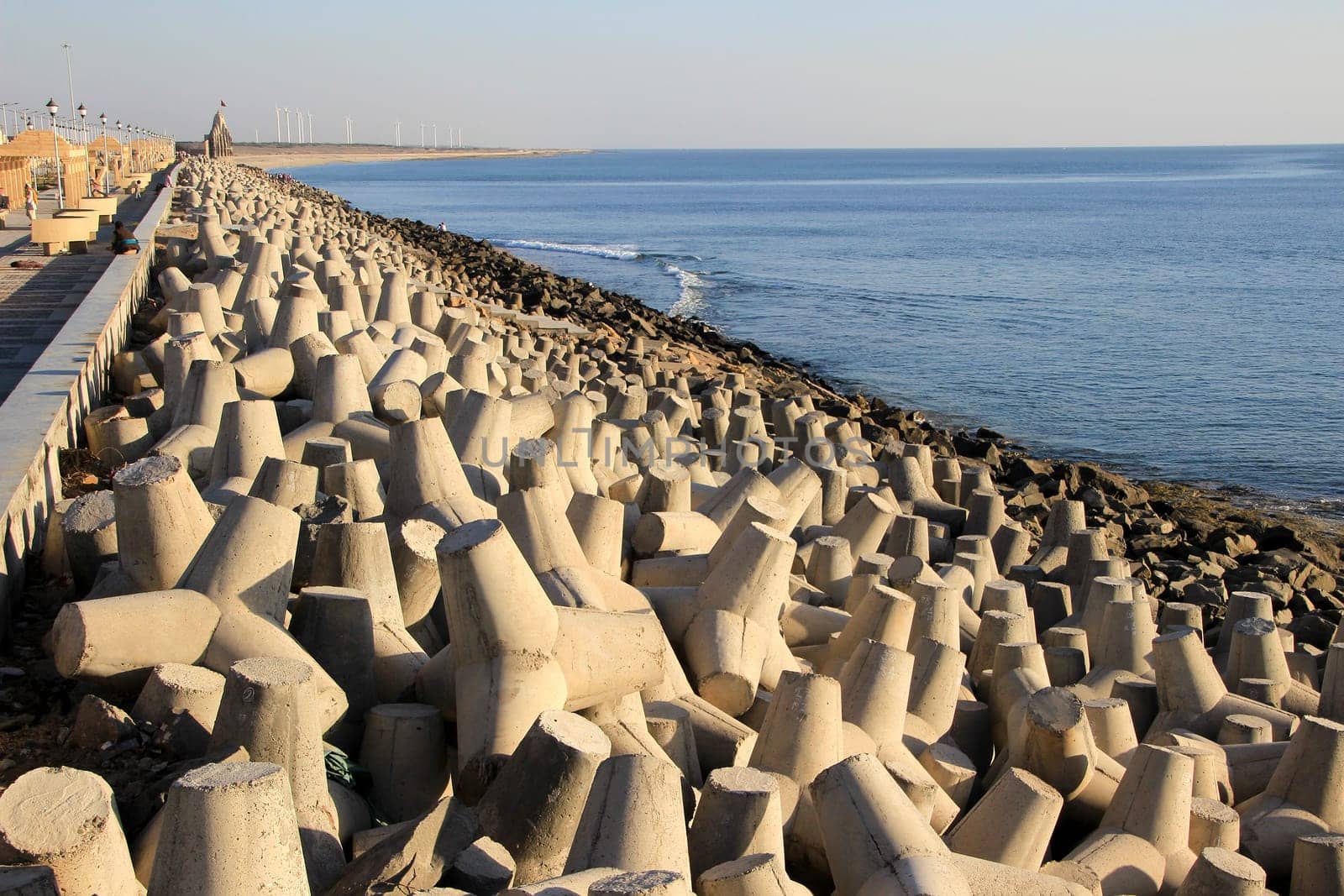 Dumping precast concrete blocks to prevent sea erosion at Port Beach, Dwaraka, Gujarath, India, Asia