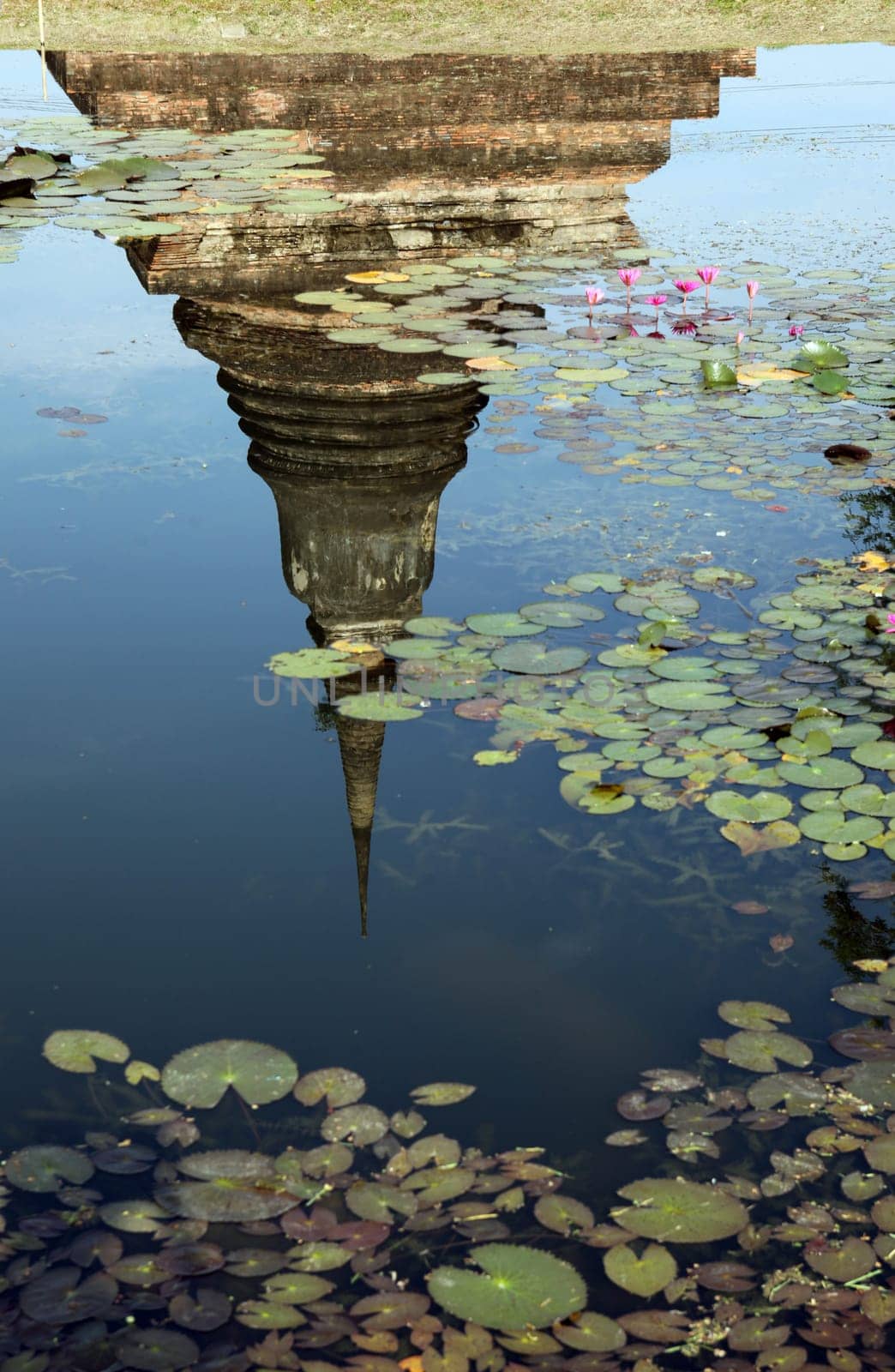 A chedi at the Wat Mahathat Temple in the temple complex of Alt-Sukhothai in Sukhothai province in northern Thailand in South East Asia.
