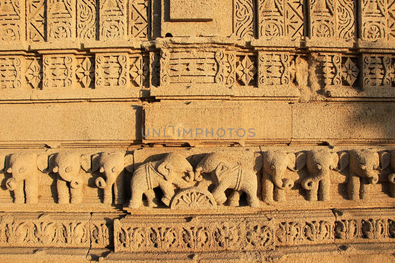 Etching of elephants in various postures on stone wall at Rukmini Temple, Dwaraka, Gujarath, India, Asia