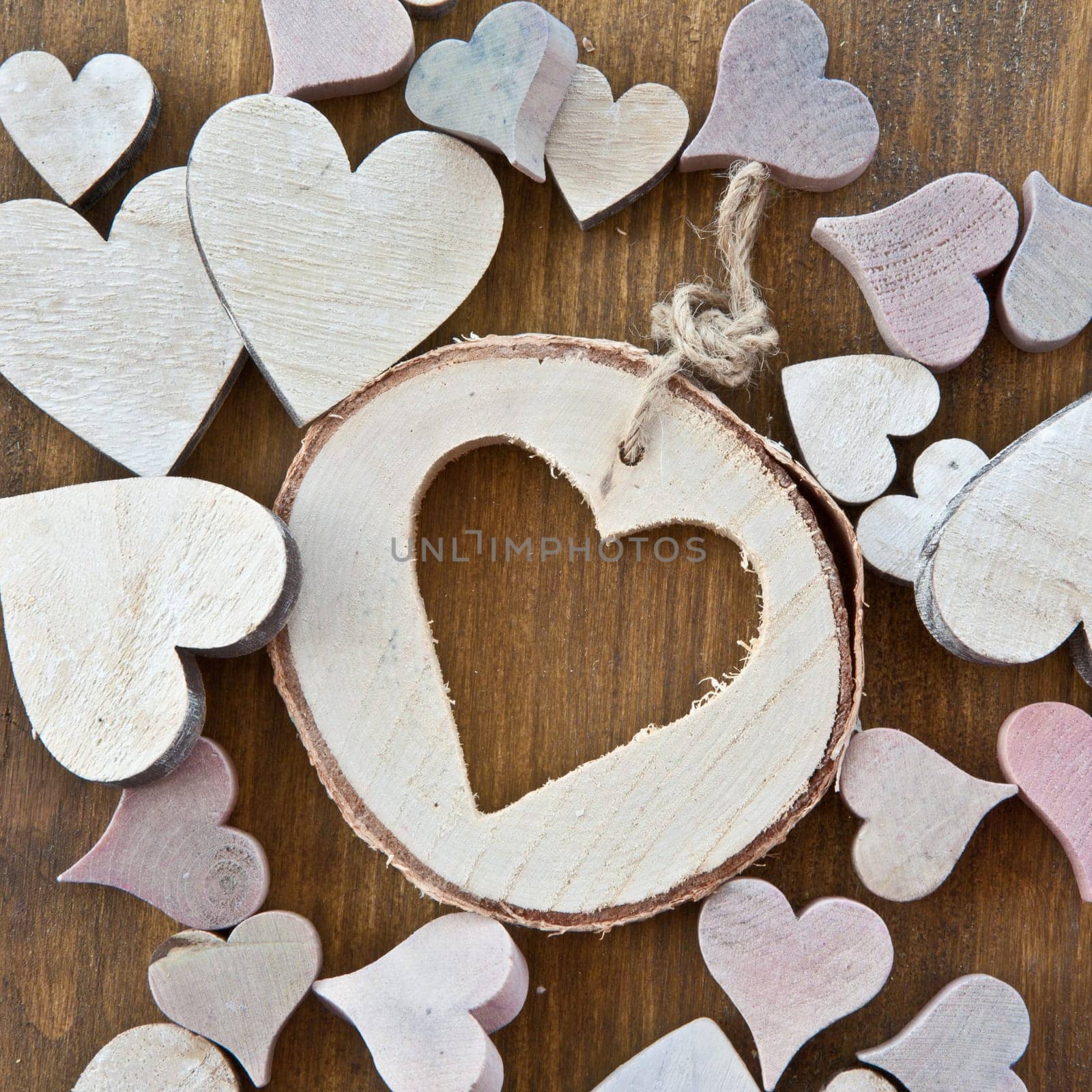 Wooden background with colorful hearts
