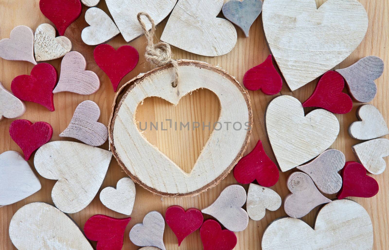 Wooden background with colorful hearts