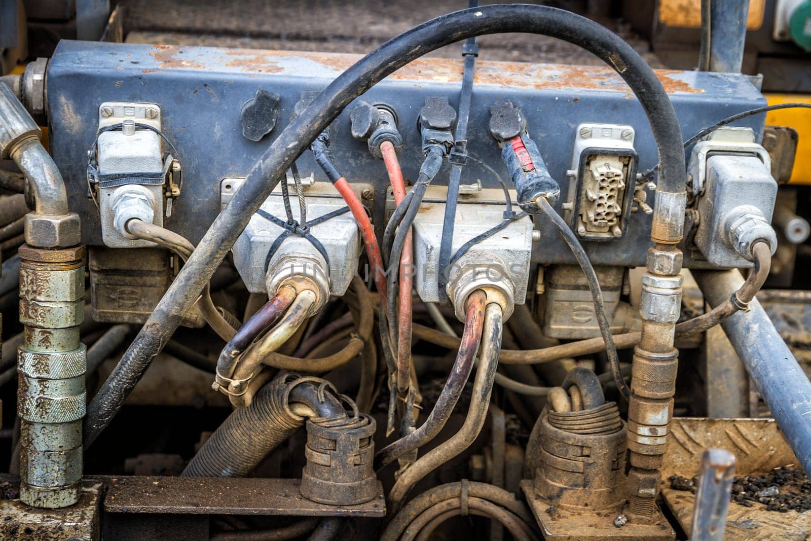 connections of an old engine, full of dirt and rust
