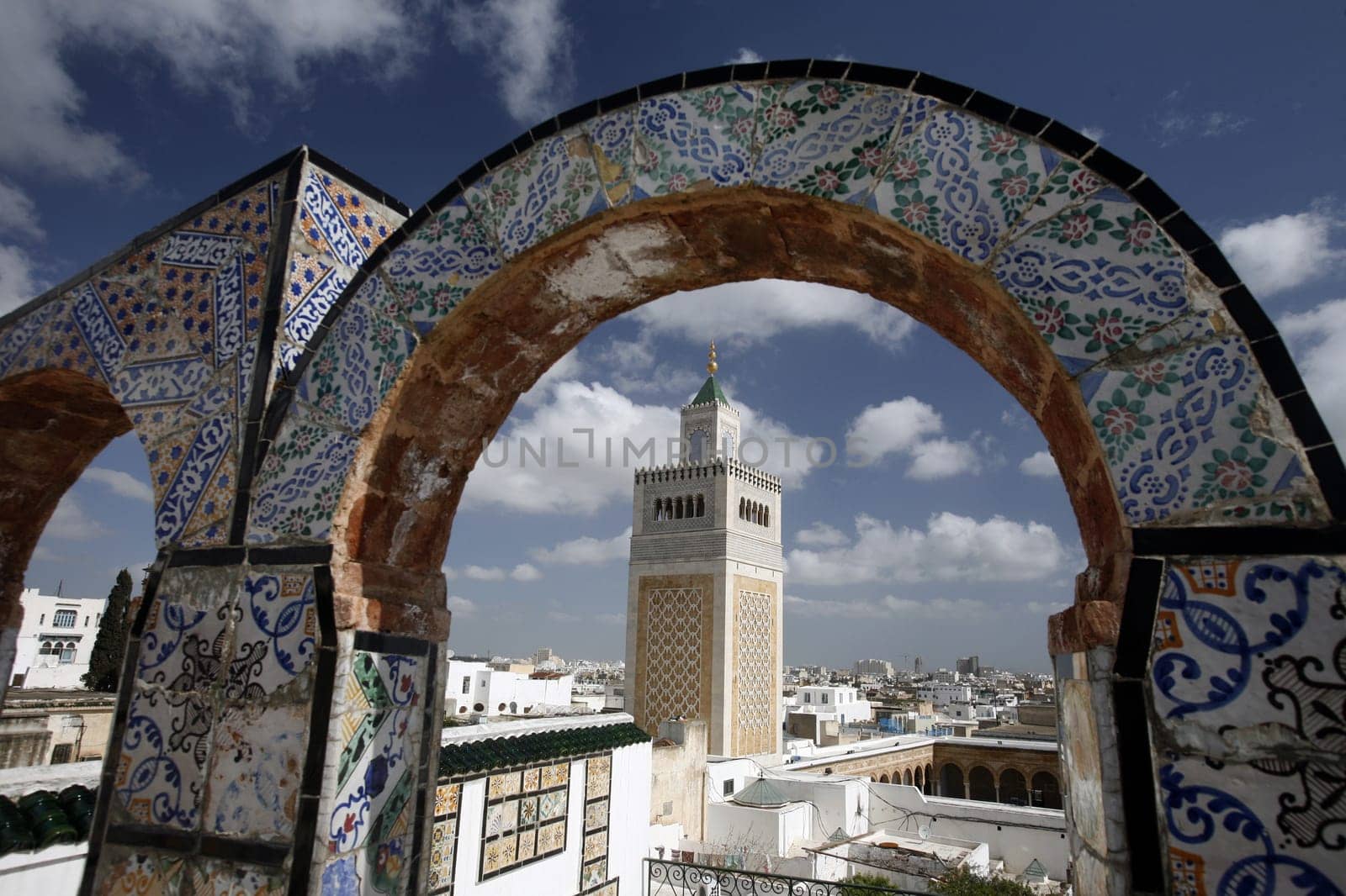 The Zaytouna Mosque or Grand Mosque in Souq or Bazzar in the Old Town of Tunis on the Mediterranean Sea in Tunisia in North Africa.