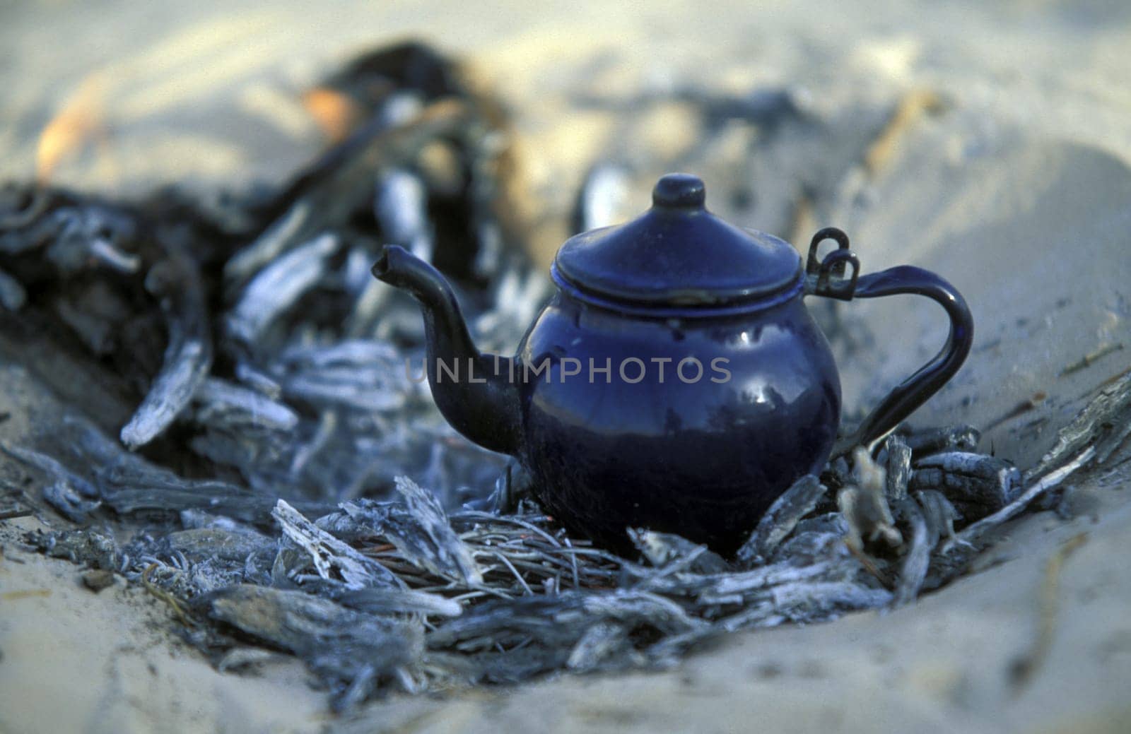 A Bedouin while cooking tea in Wuestensand in douz in the south of Tunisia in North Africa.