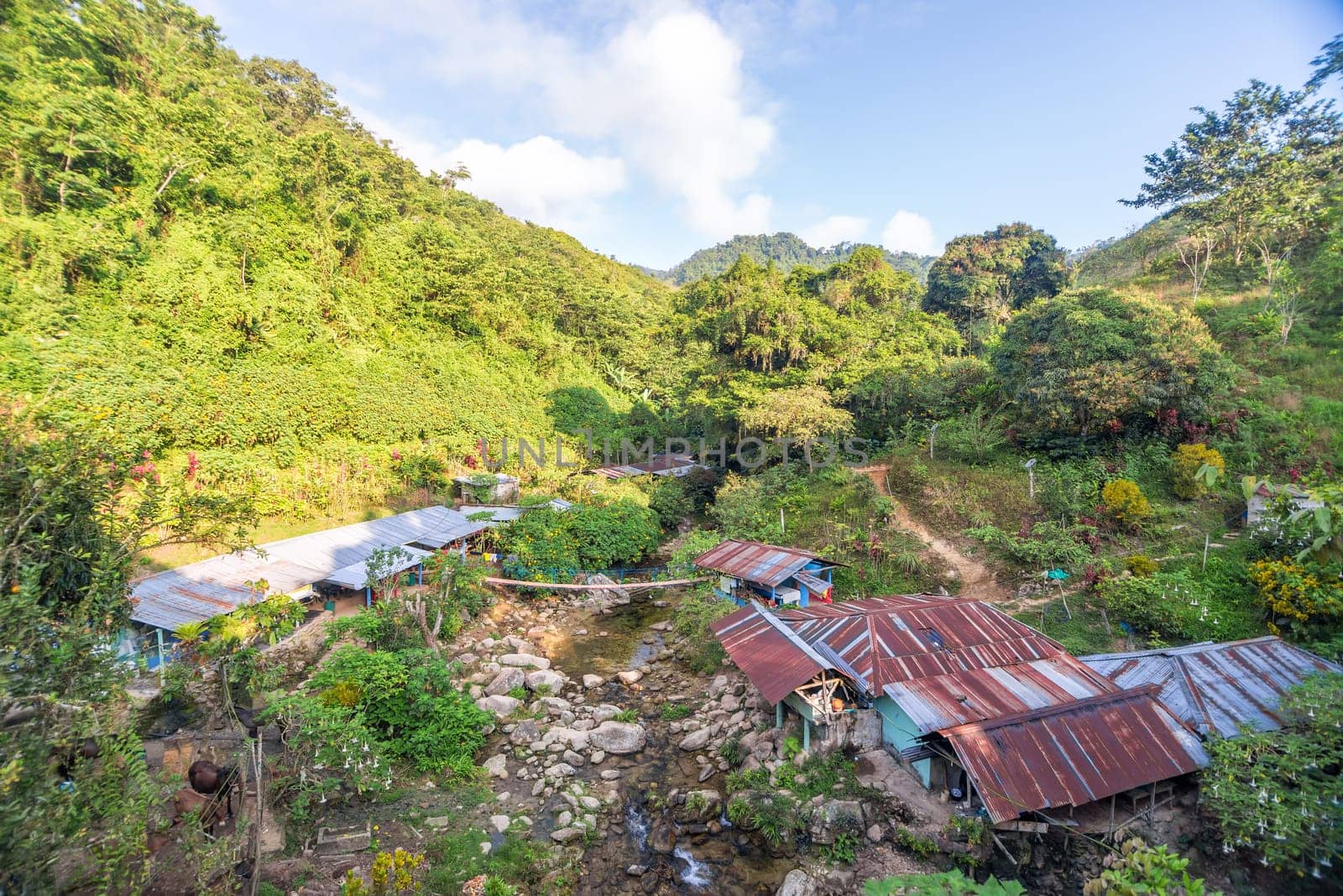 Rustic shacks in a beautiful valley in the Sierra Nevada de Santa Marta in Colombia