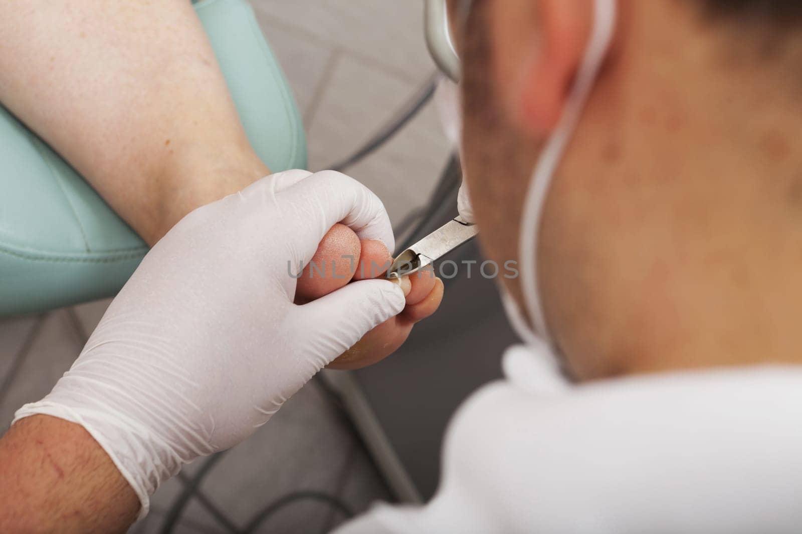 View over the shoulder of a foot care worker